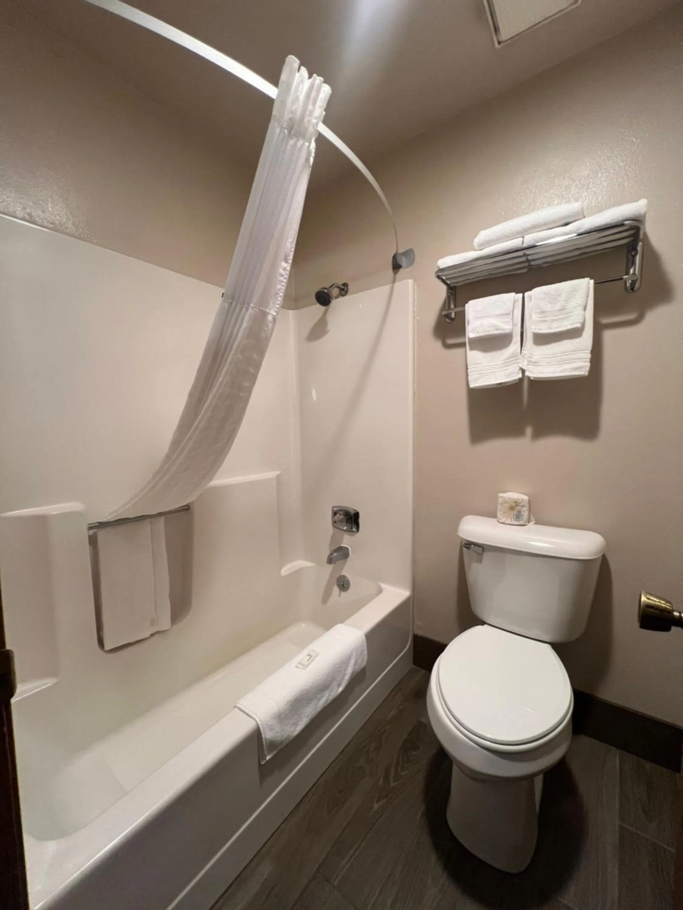 Toilet in Super 8 by Wyndham Sturgis