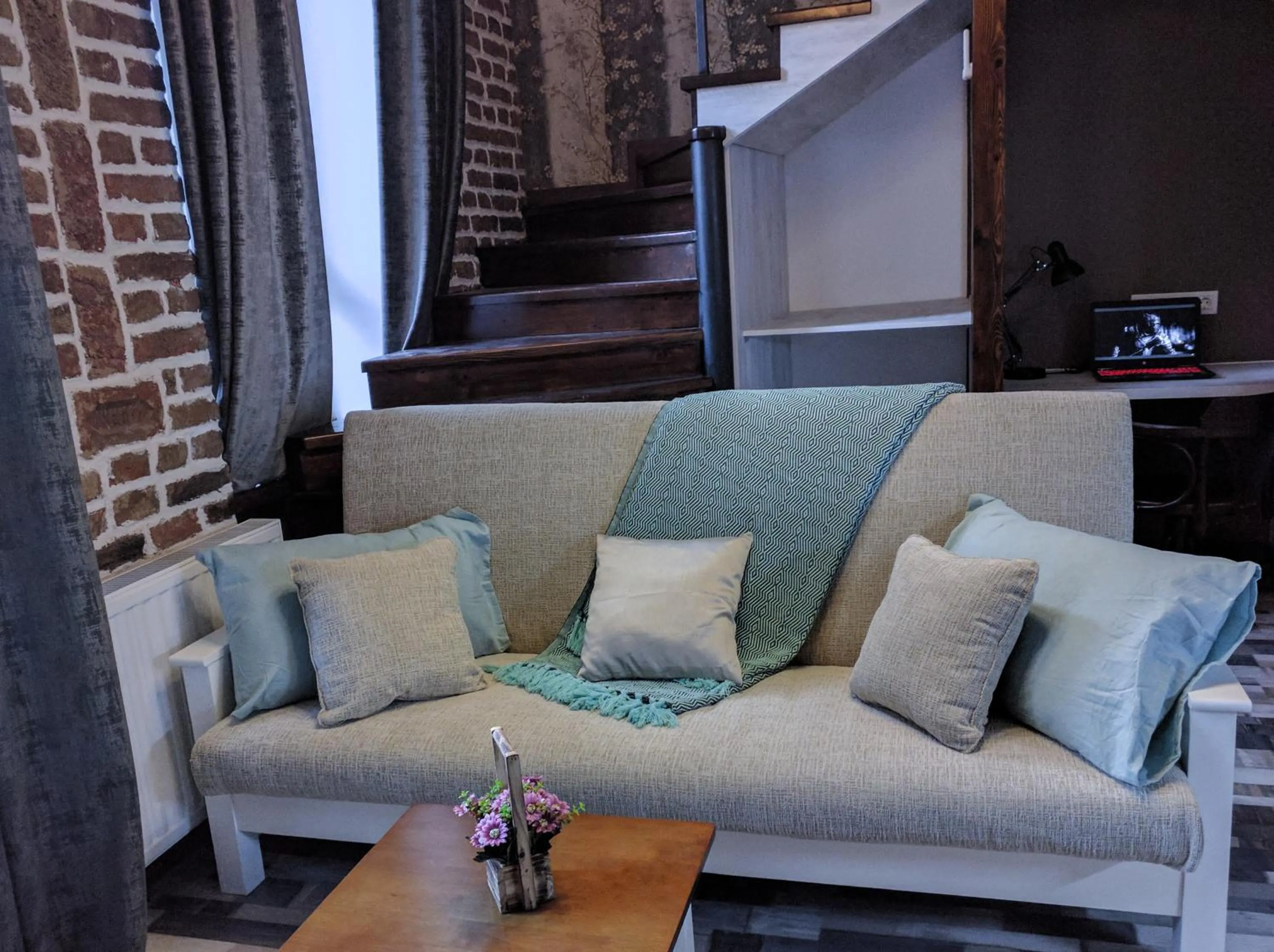 Living room in Cozy Studios on Freedom Square