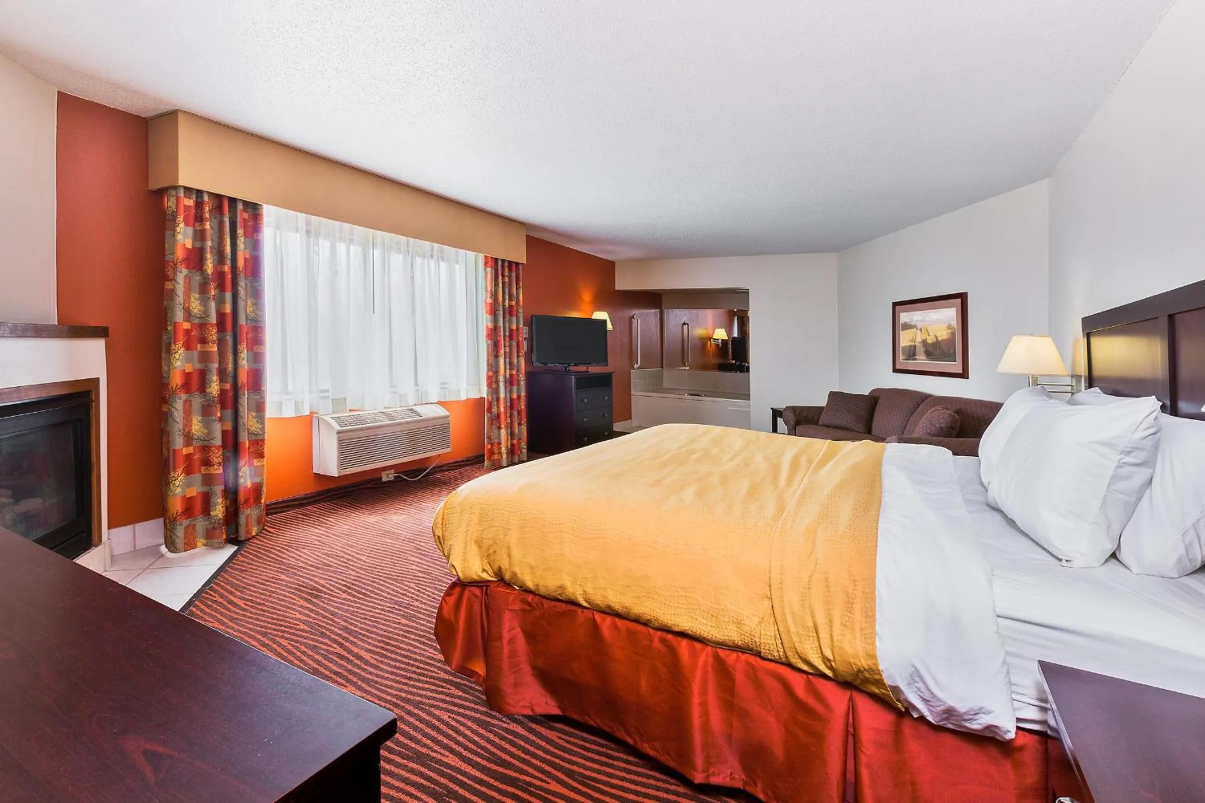 Bed in AmericInn by Wyndham Muscatine