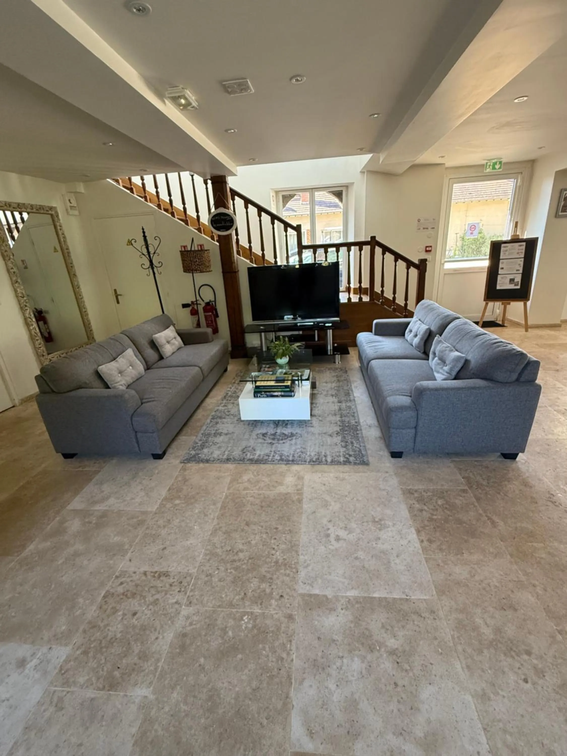 Communal lounge/ TV room in Le Moulin Bleu