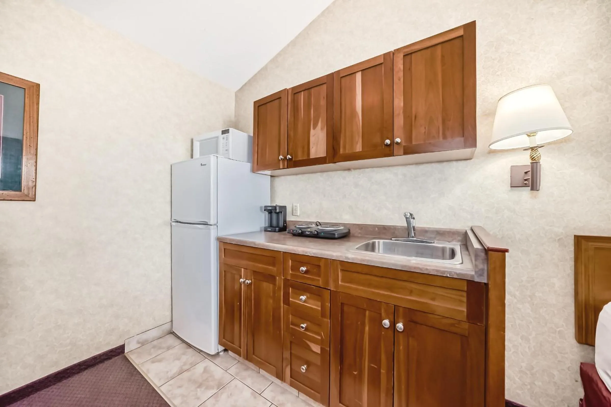 Kitchen or kitchenette in Stony Plain Inn & Suites