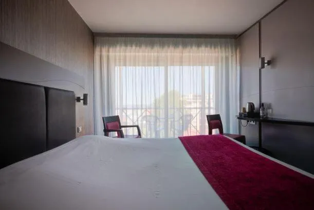 Bed in Hôtel Le Nautic