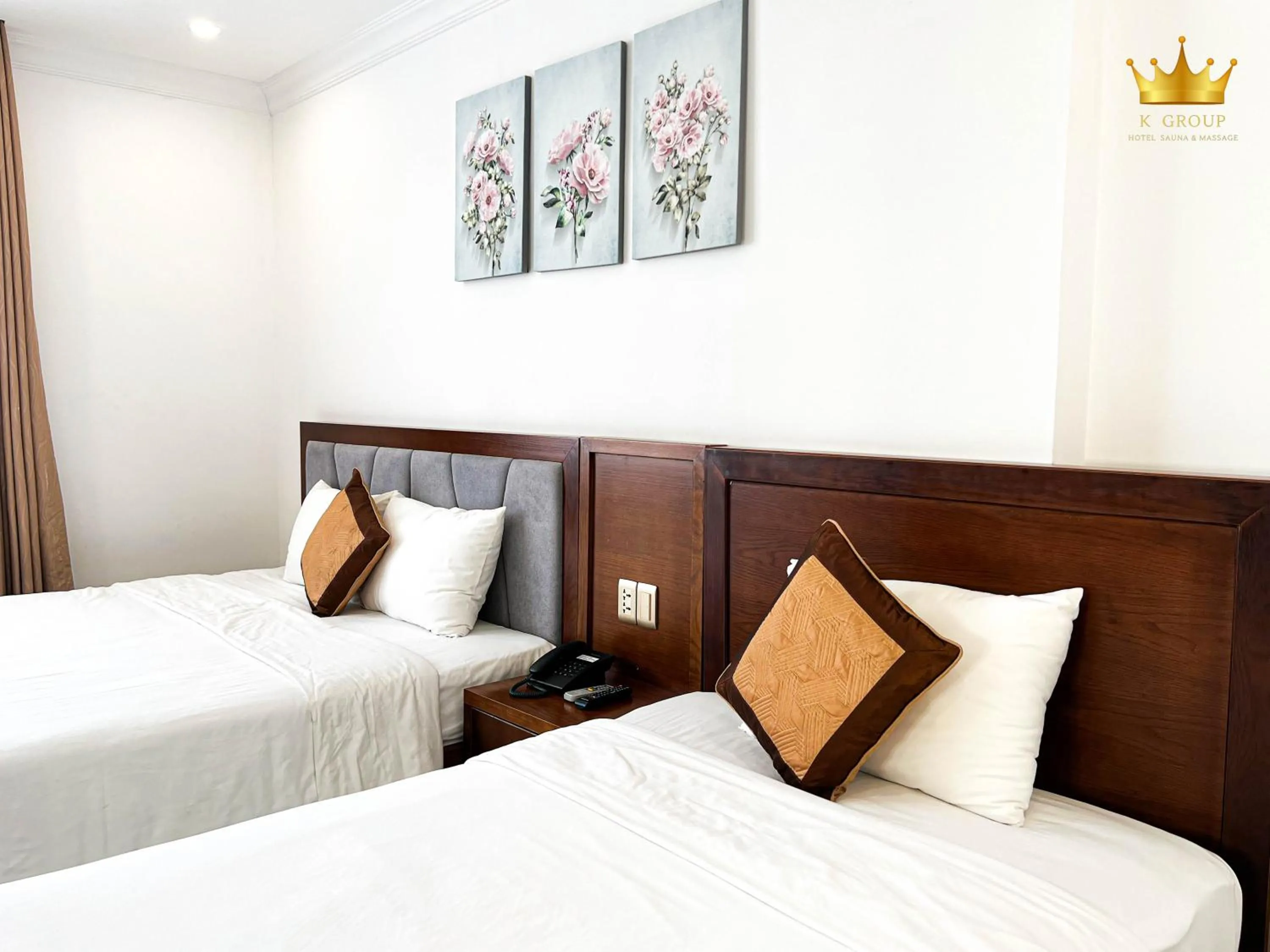 Bed in K Hotel Sauna and Massage