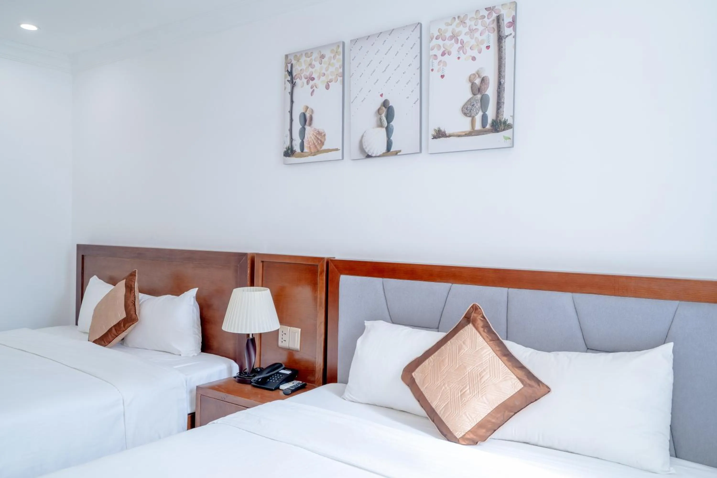 Bed in K Hotel Sauna and Massage