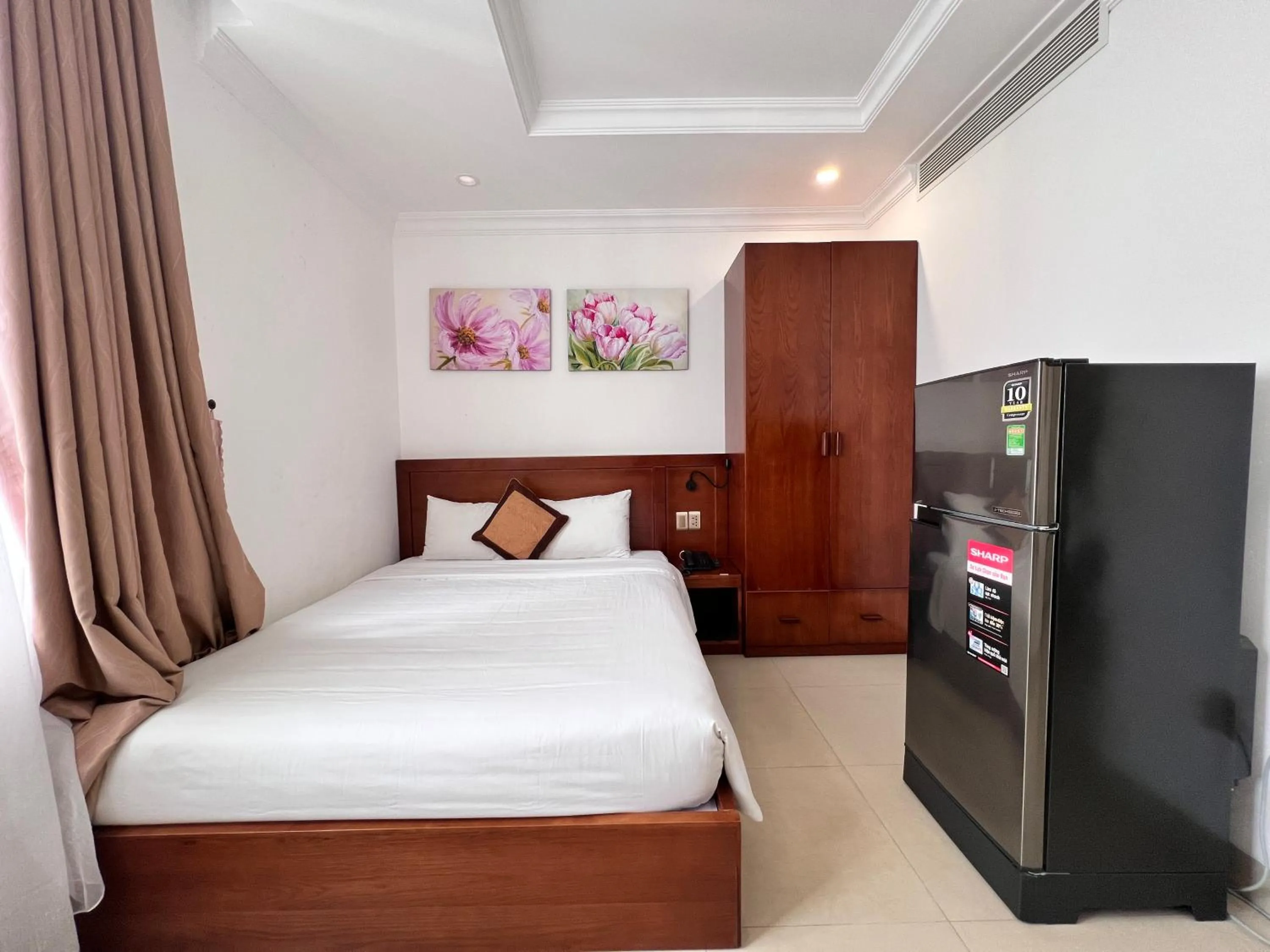 Bed in K Hotel Sauna and Massage