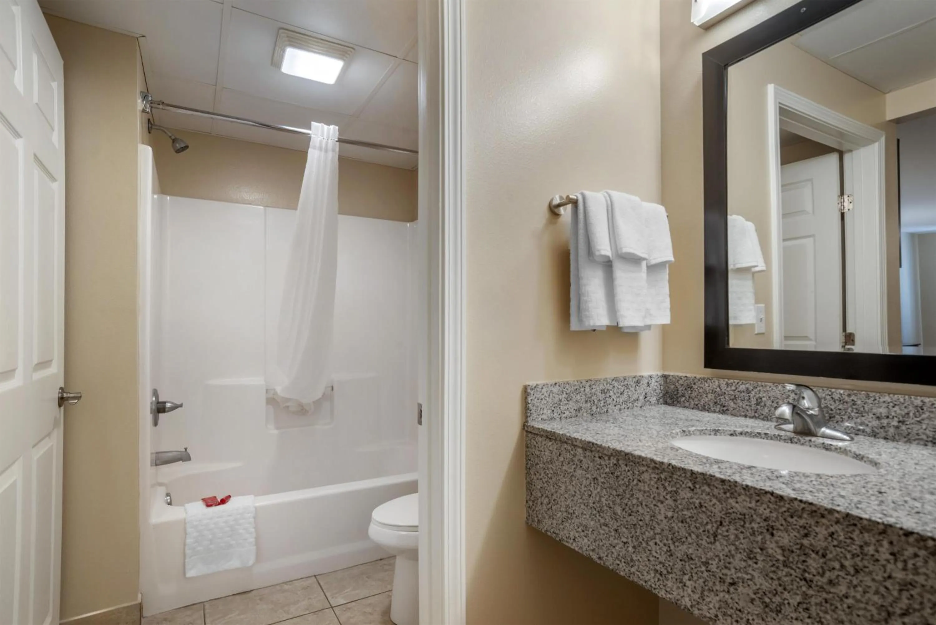 Bathroom in SureStay Studio by Best Western Gonzales