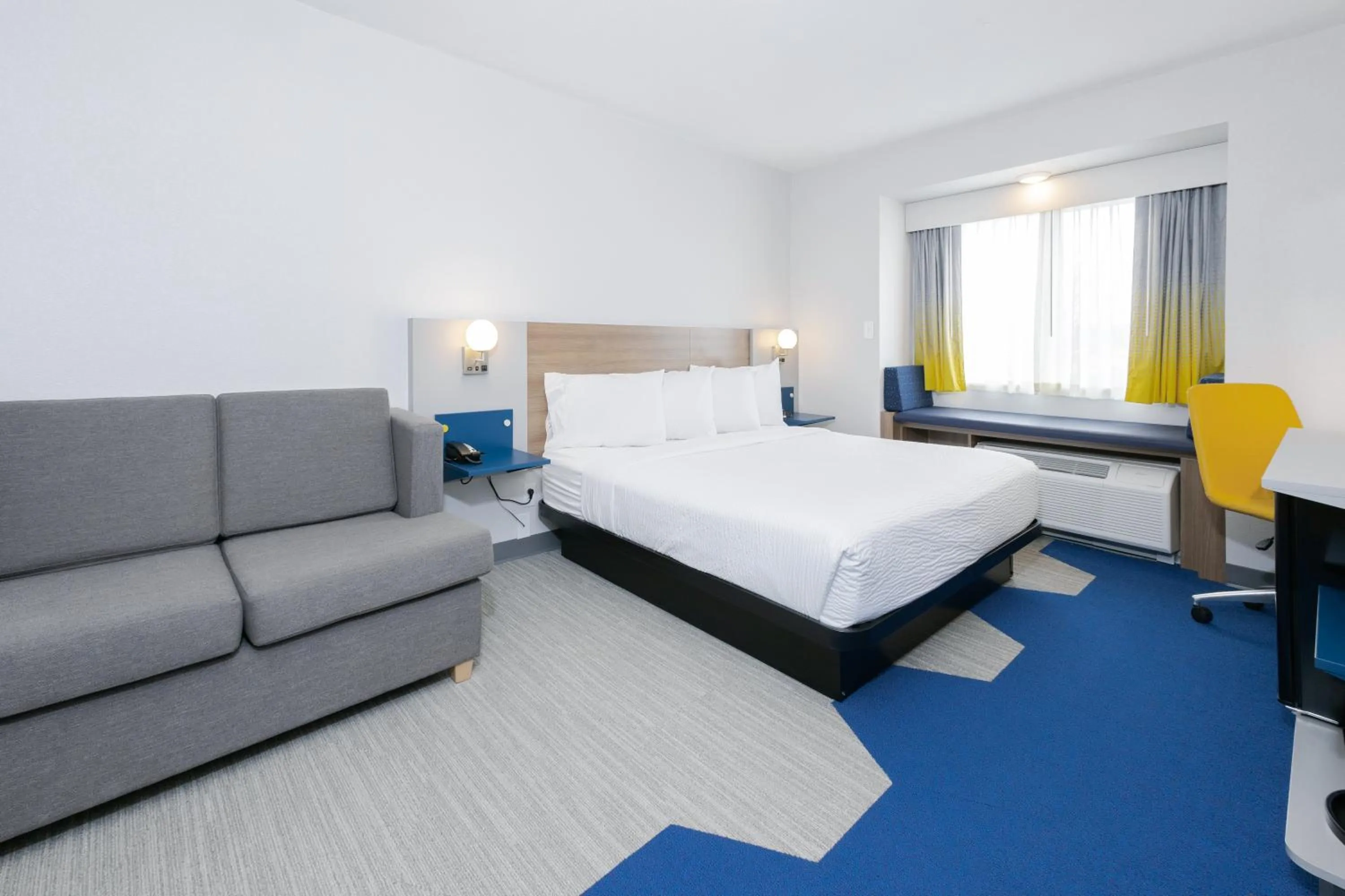 Bed in Microtel Inn & Suites by Wyndham Wellsville