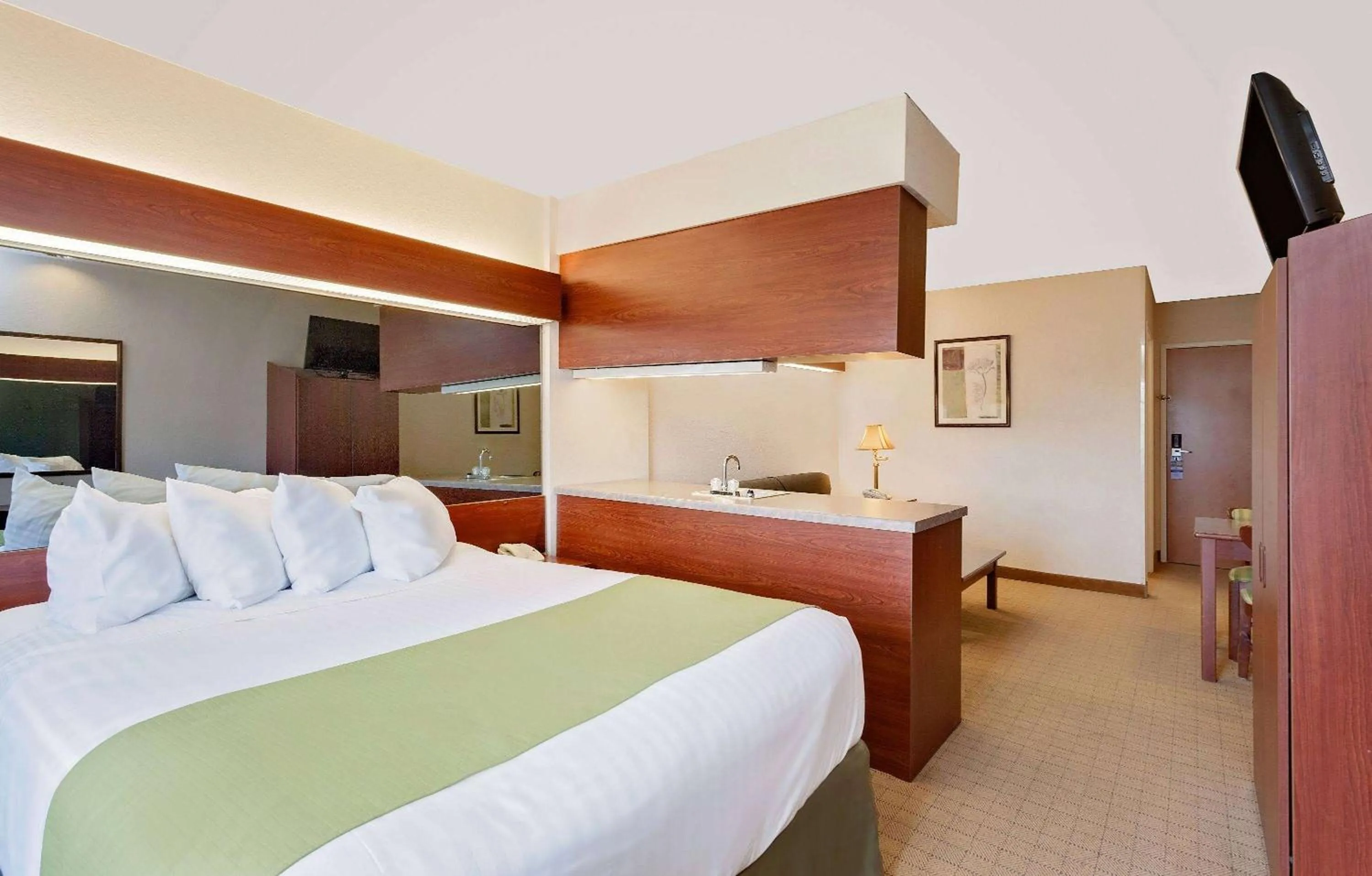 Bed in Microtel Inn & Suites by Wyndham Wellsville