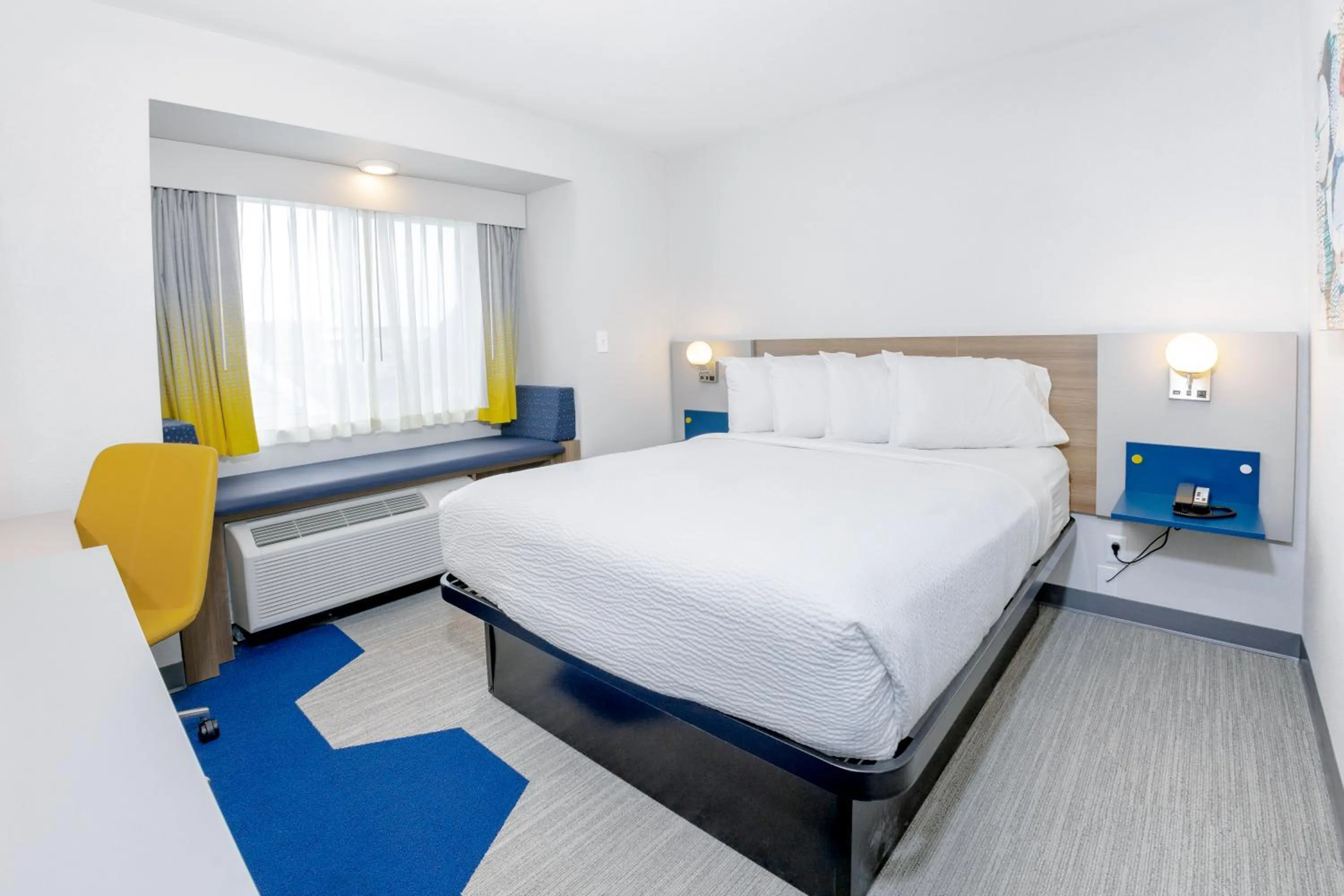 Bed in Microtel Inn & Suites by Wyndham Wellsville