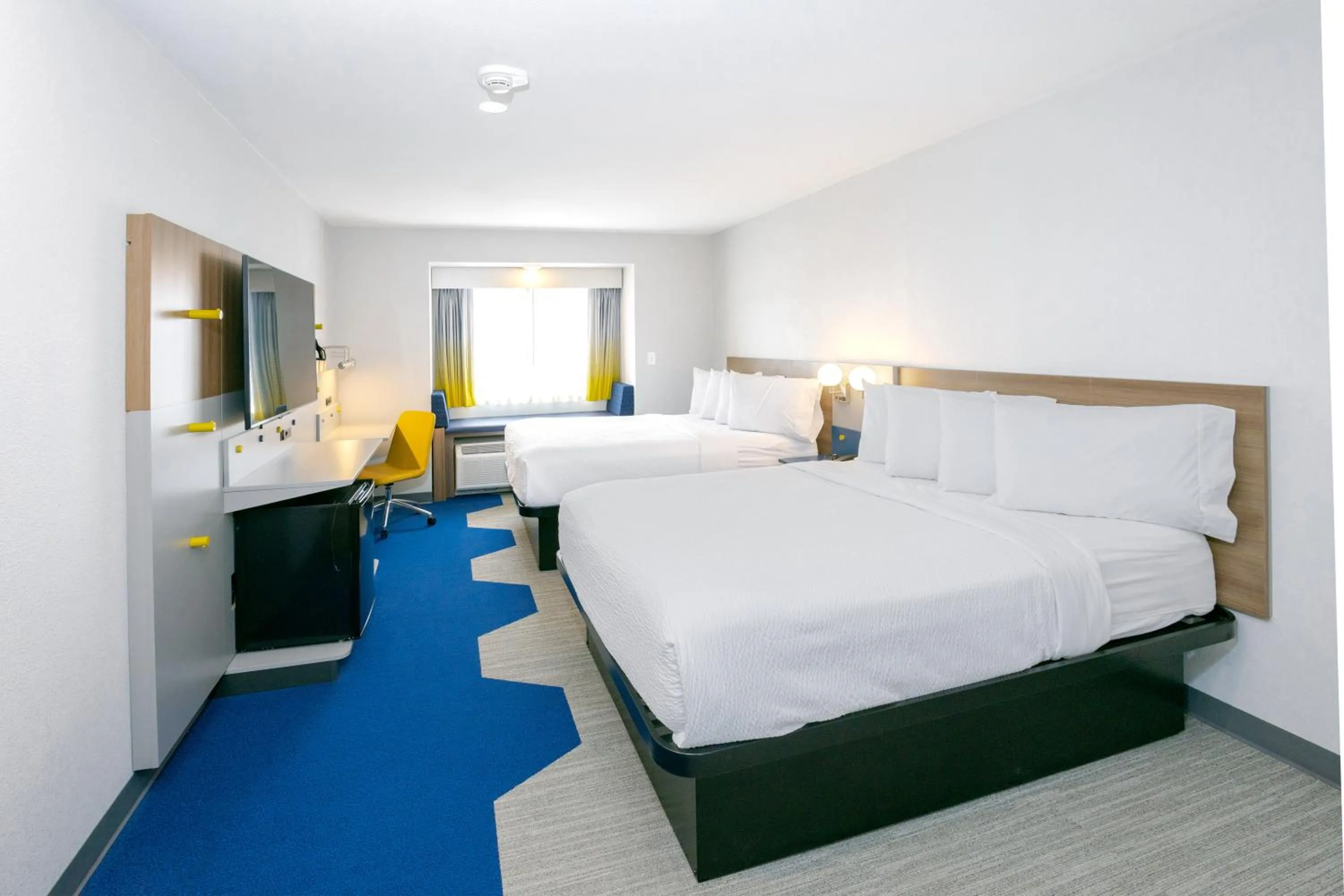 Bed in Microtel Inn & Suites by Wyndham Wellsville