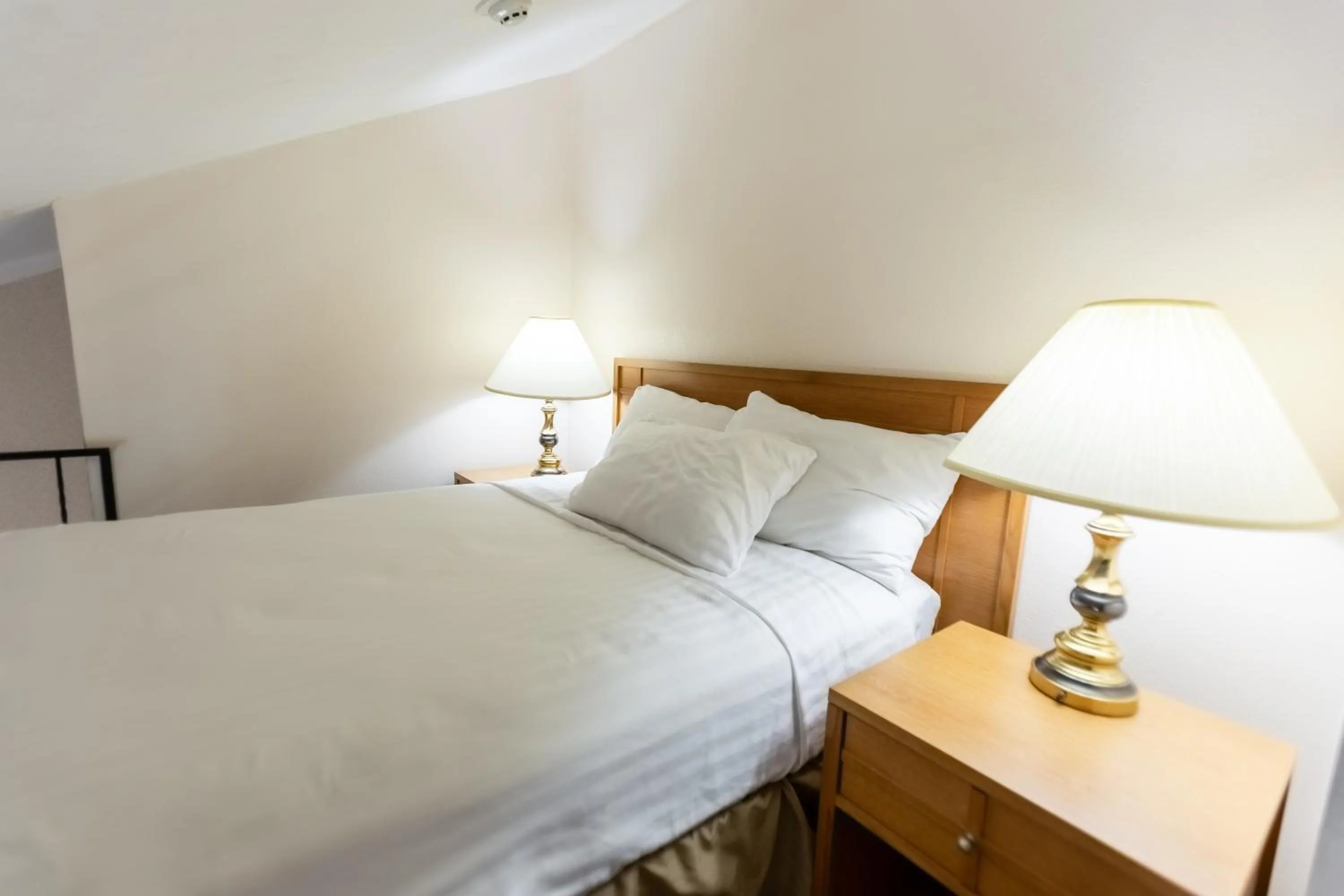 Bed in RiverTree Inn & Suites