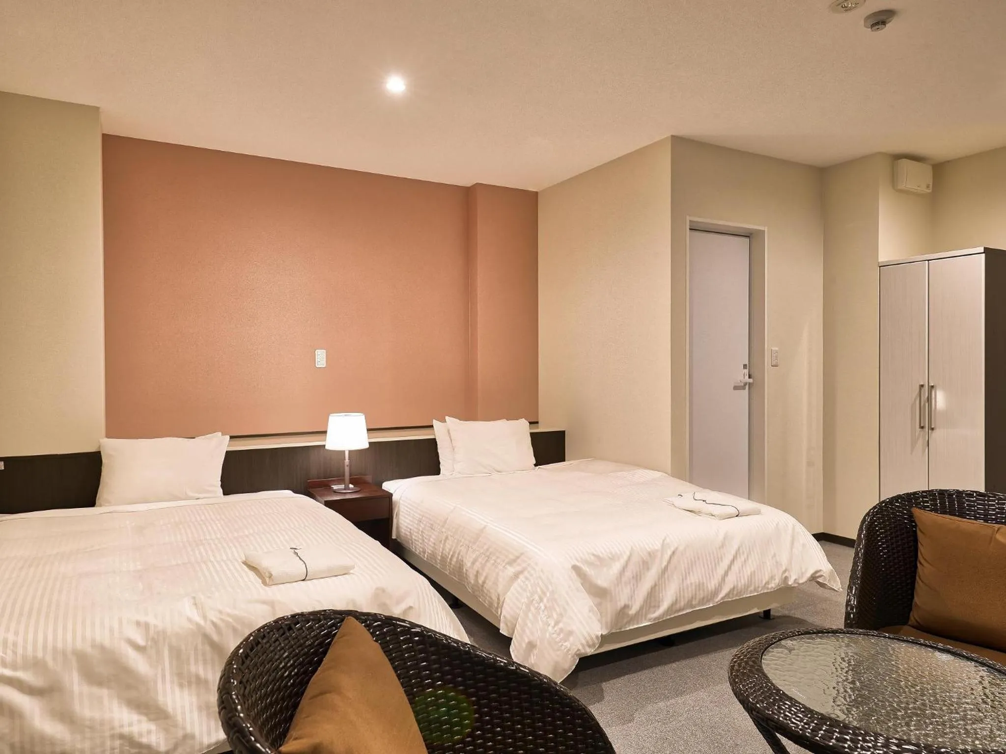 Living room, Bed in Crown Hotel Okinawa Annex