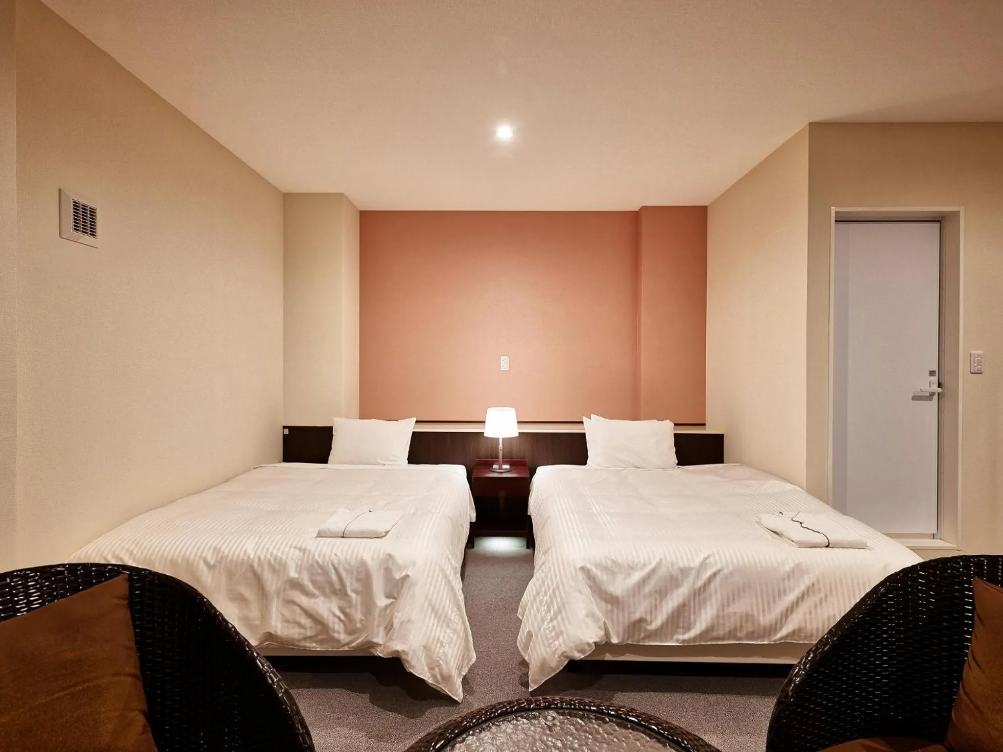 Bedroom, Bed in Crown Hotel Okinawa Annex