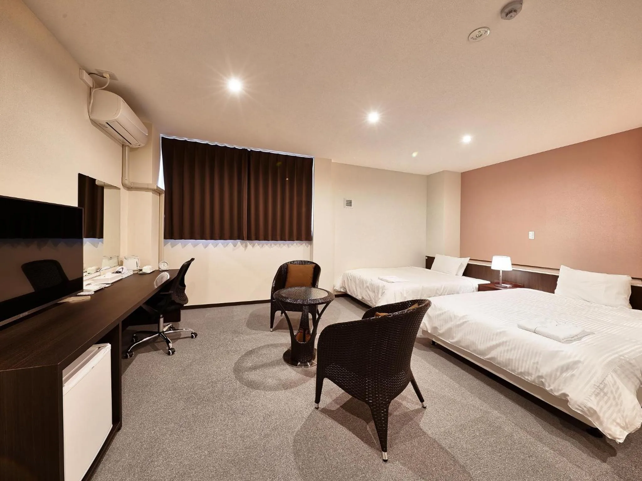 Living room, Bed in Crown Hotel Okinawa Annex