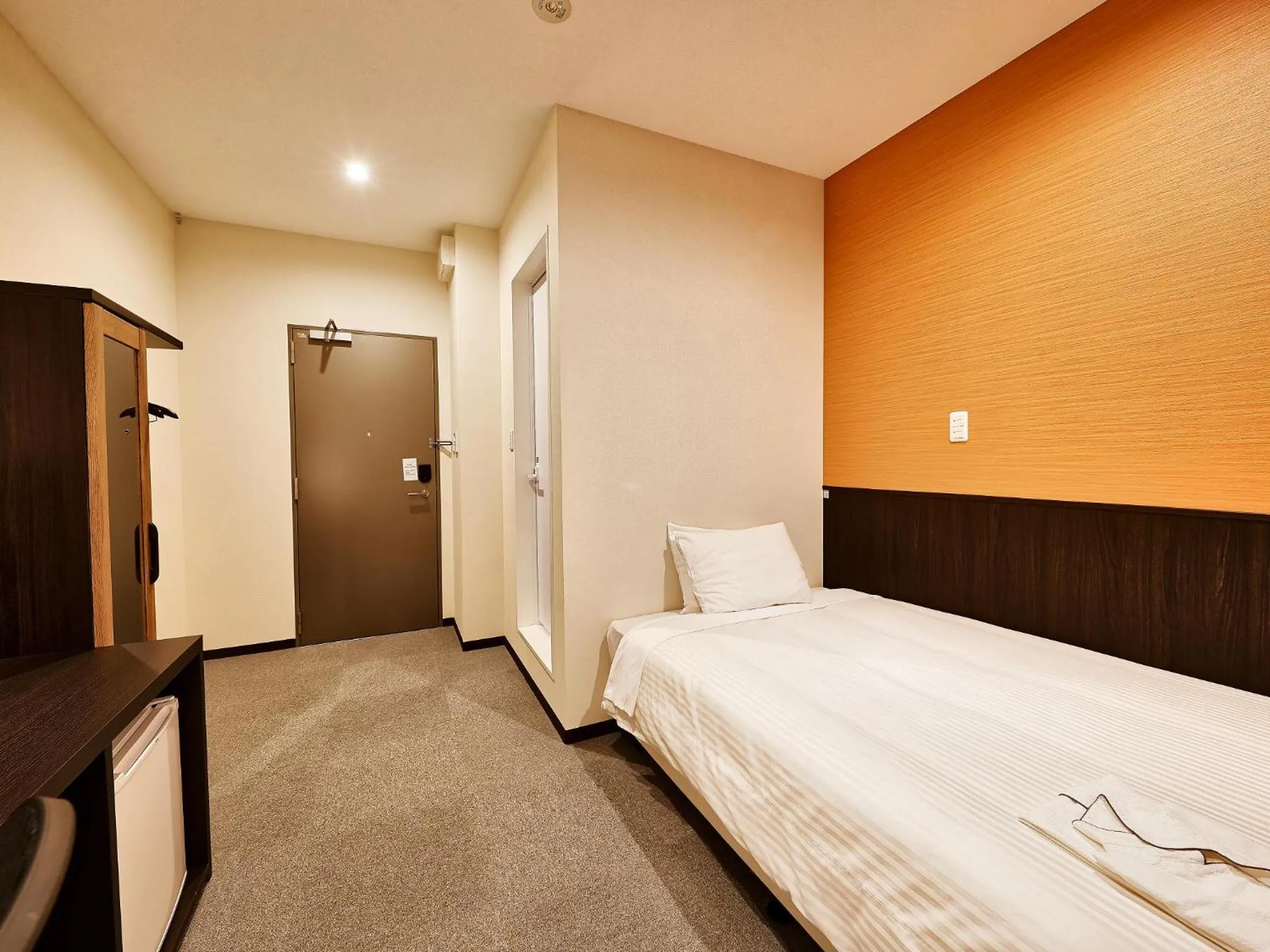 Living room, Bed in Crown Hotel Okinawa Annex