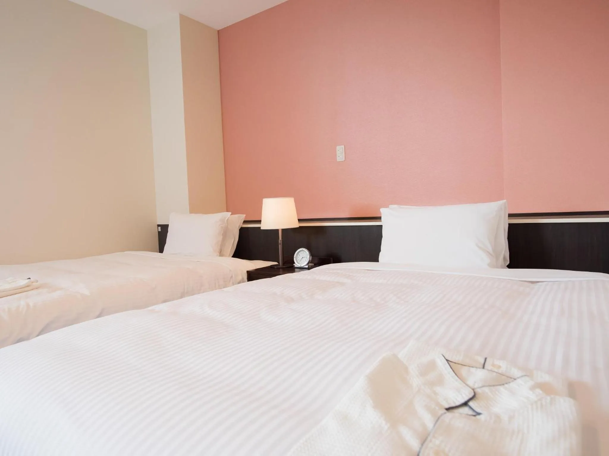 Bedroom, Bed in Crown Hotel Okinawa Annex