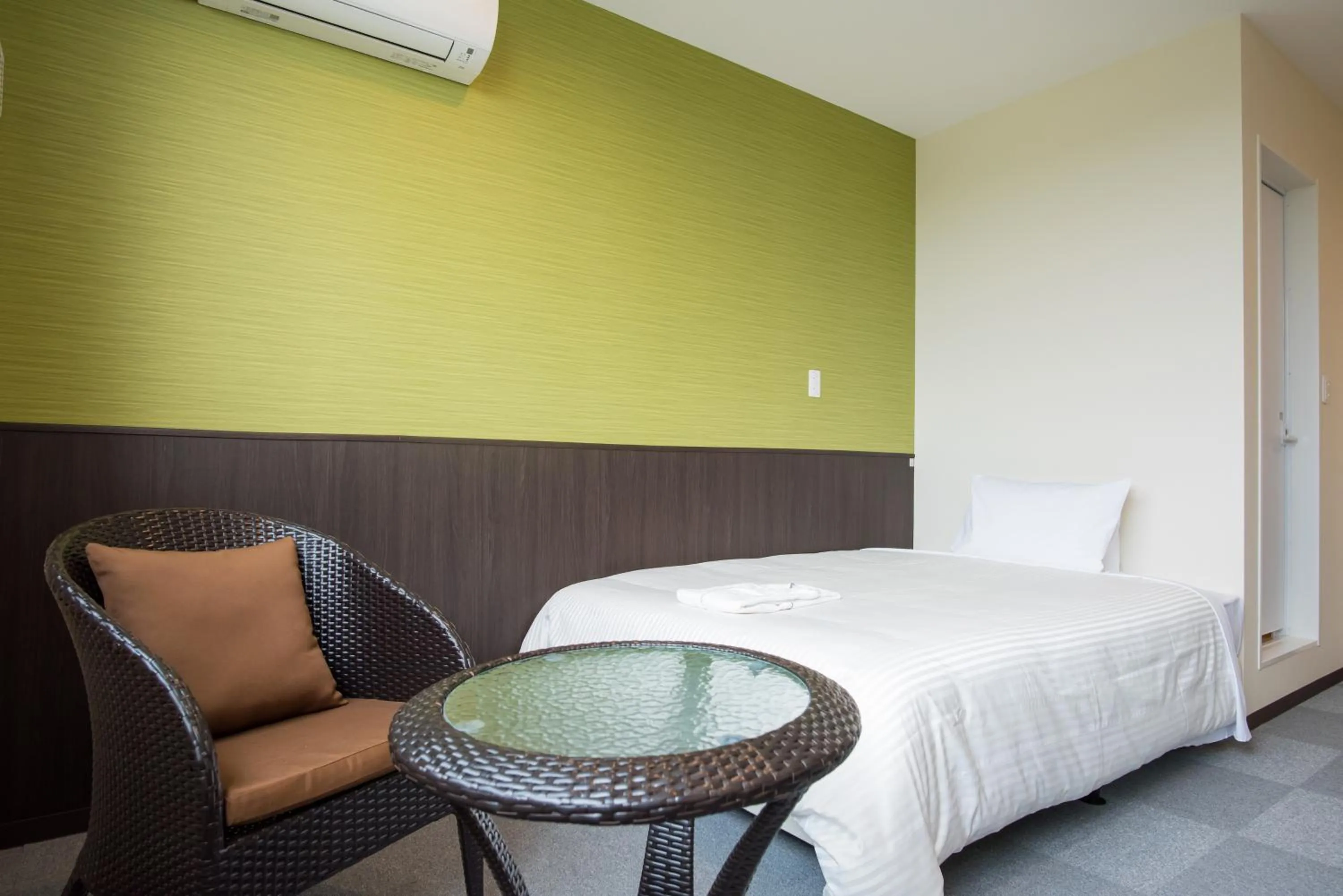 Bed in Crown Hotel Okinawa Annex