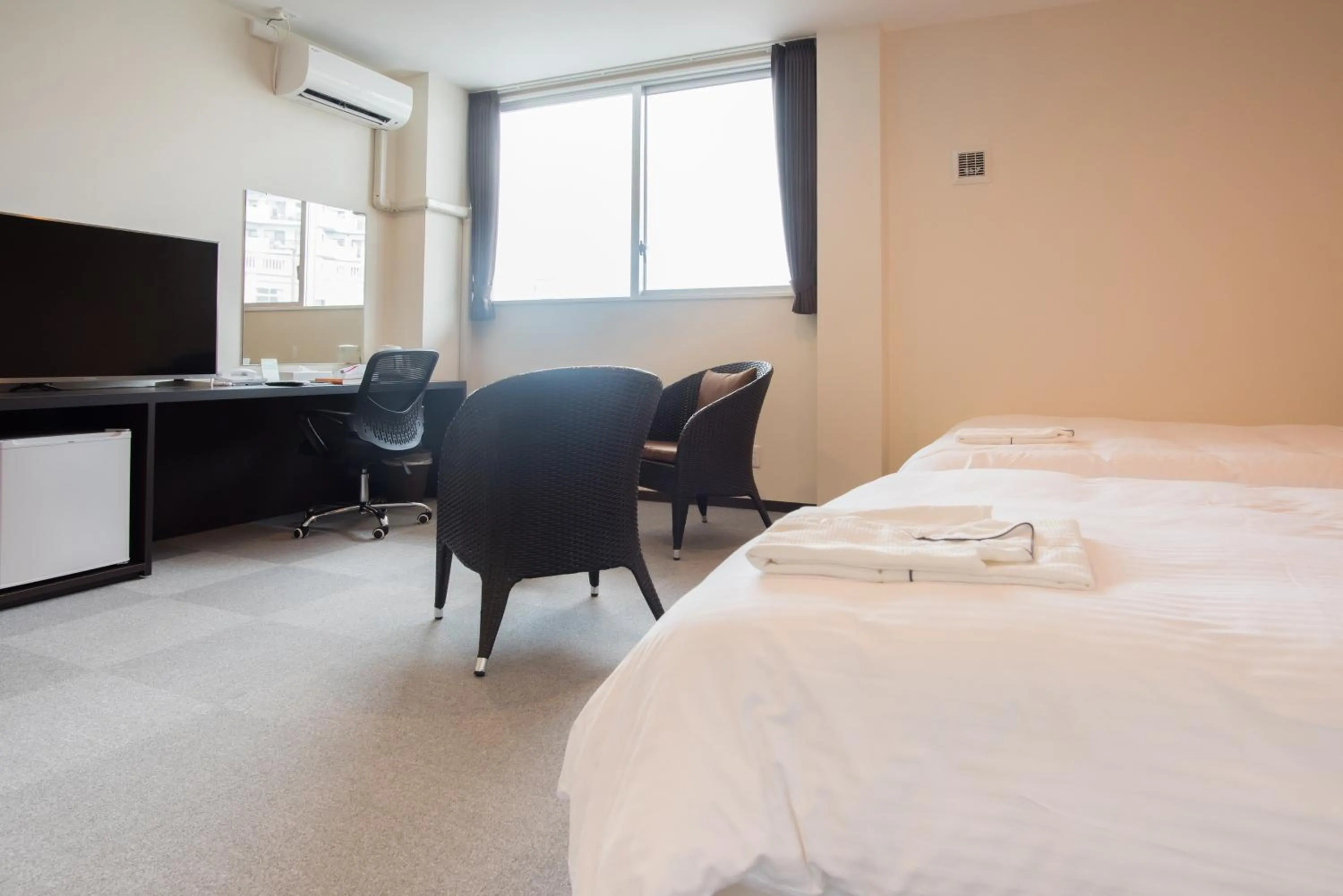 TV and multimedia, Bed in Crown Hotel Okinawa Annex