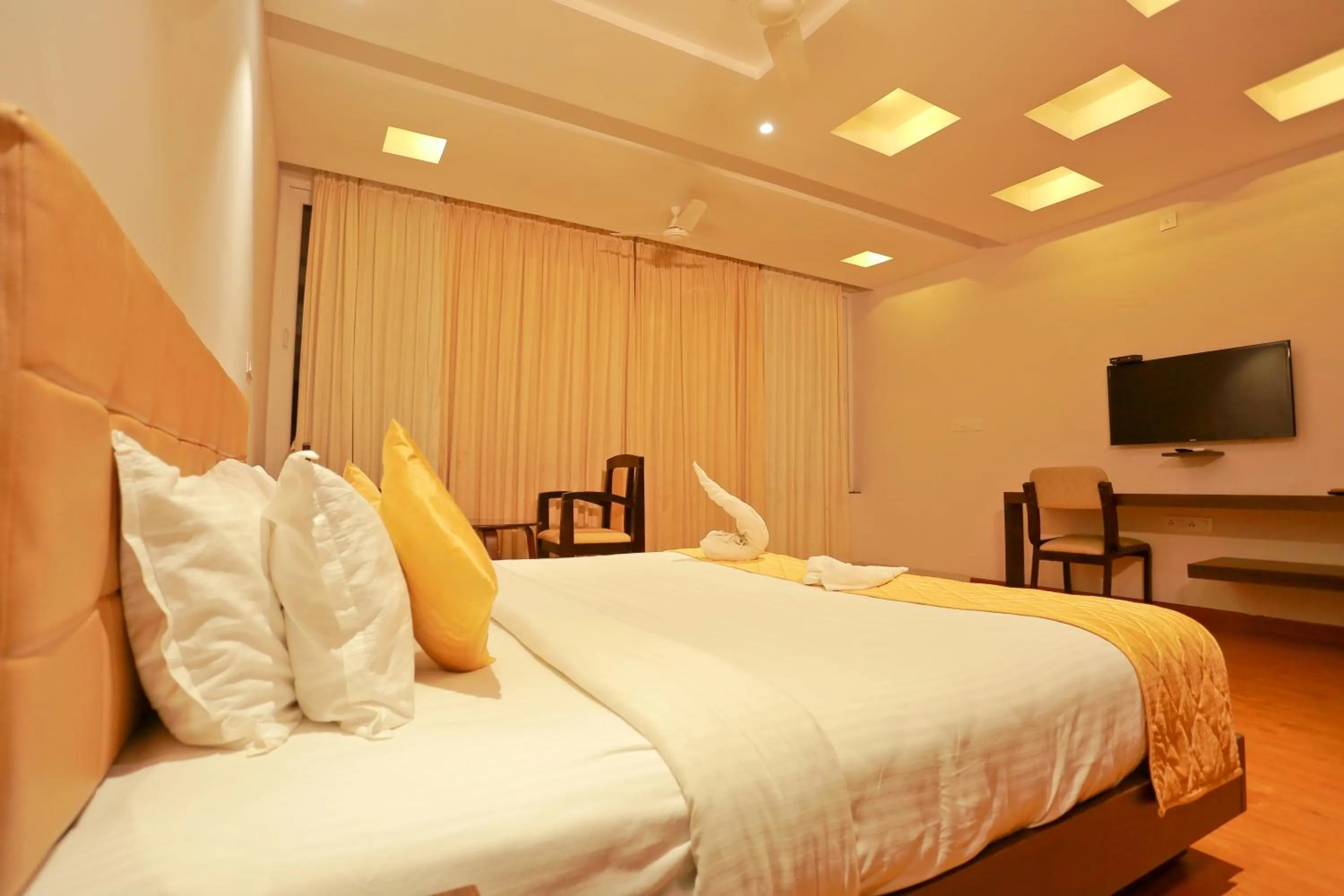 Bed in Grand Signature Hotel & spa