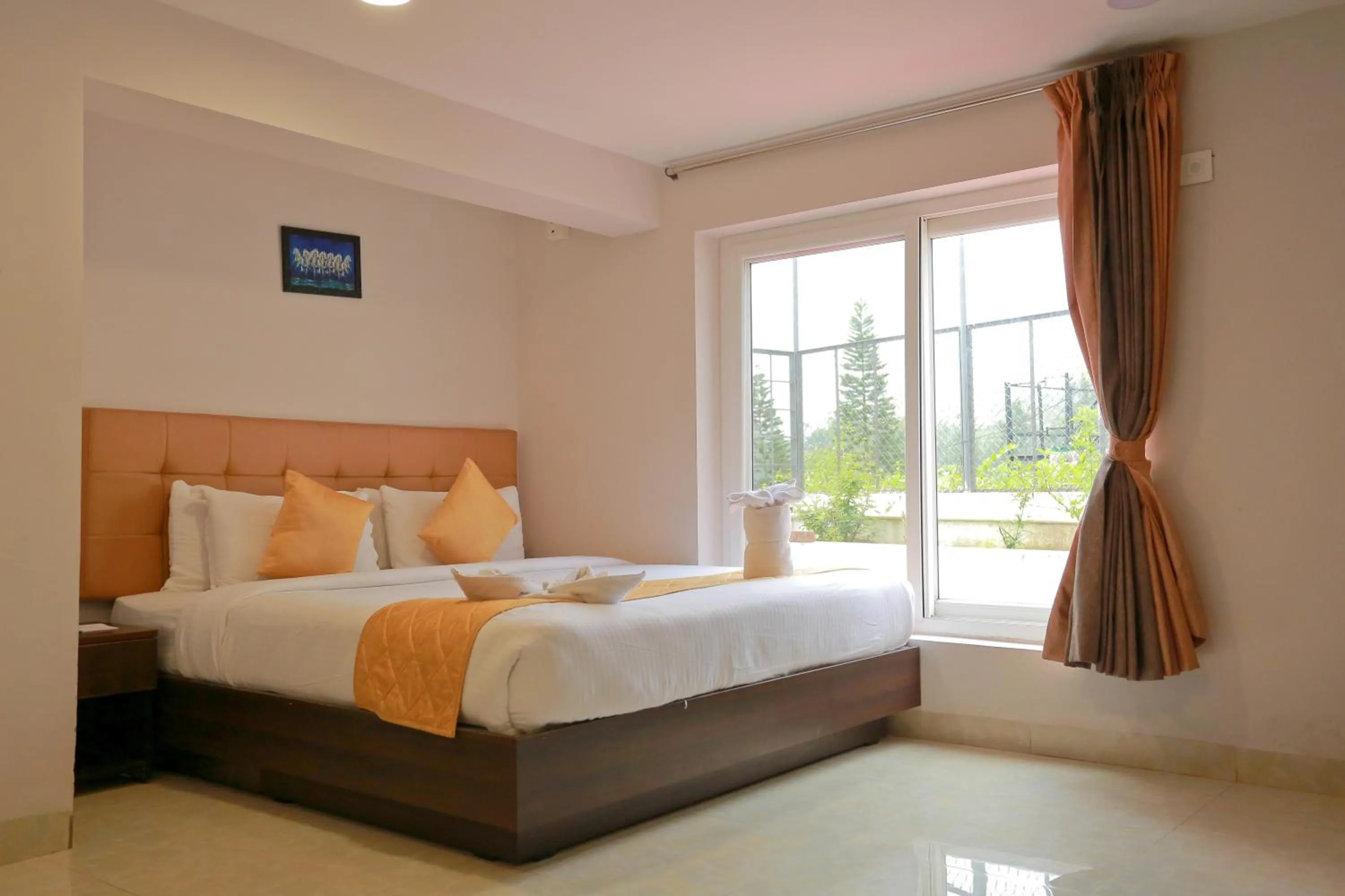 Bed in Grand Signature Hotel & spa