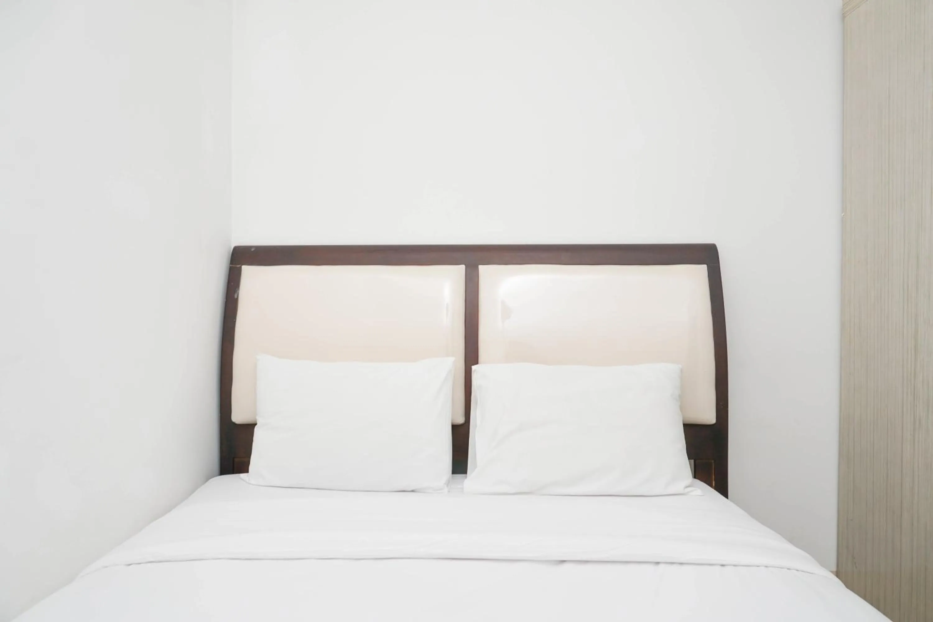 Bed in Spacious 2BR Green Bay Pluit Apartment By Travelio