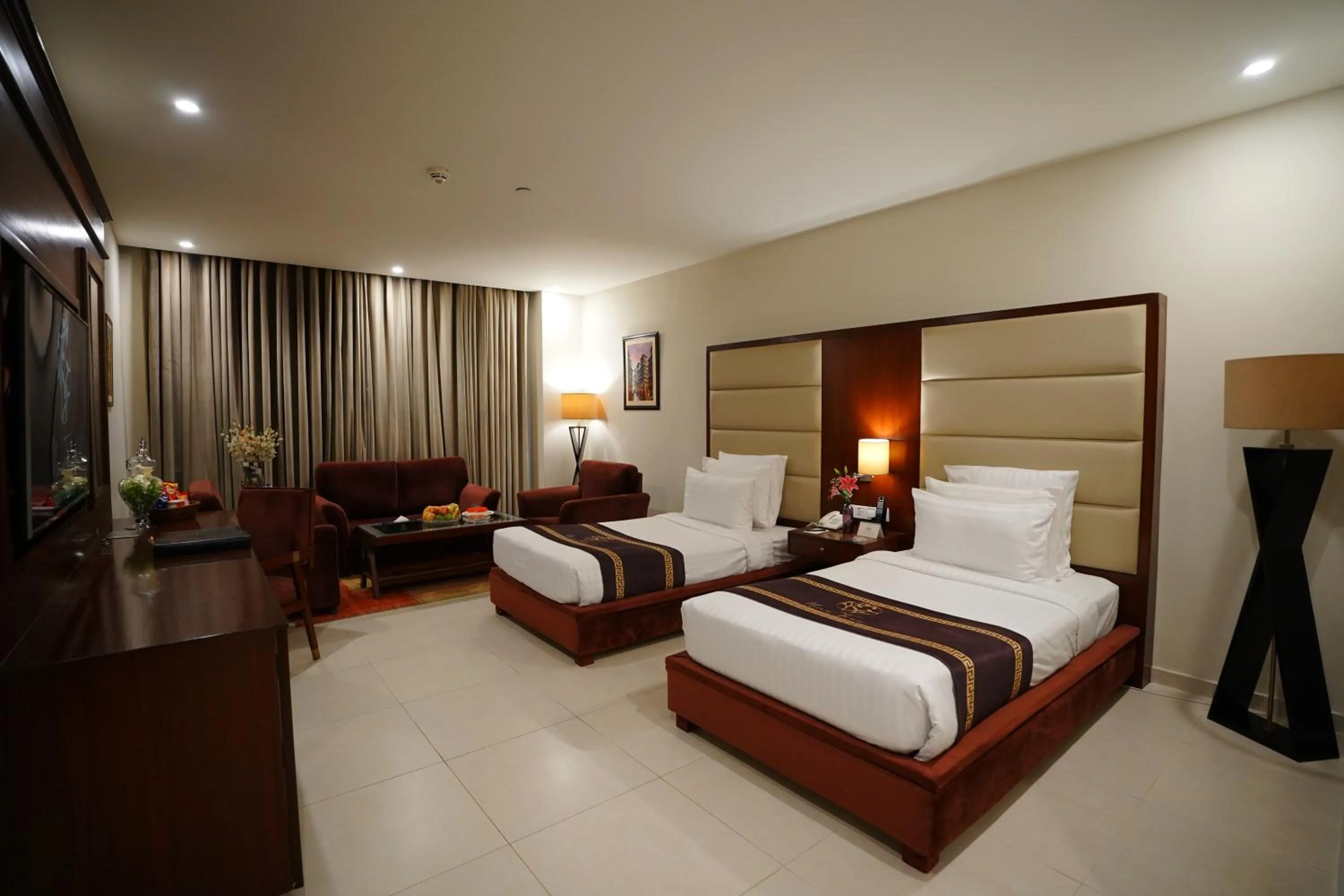 Photo of the whole room, Bed in Nine Tree Luxury Hotel & Suites Lahore