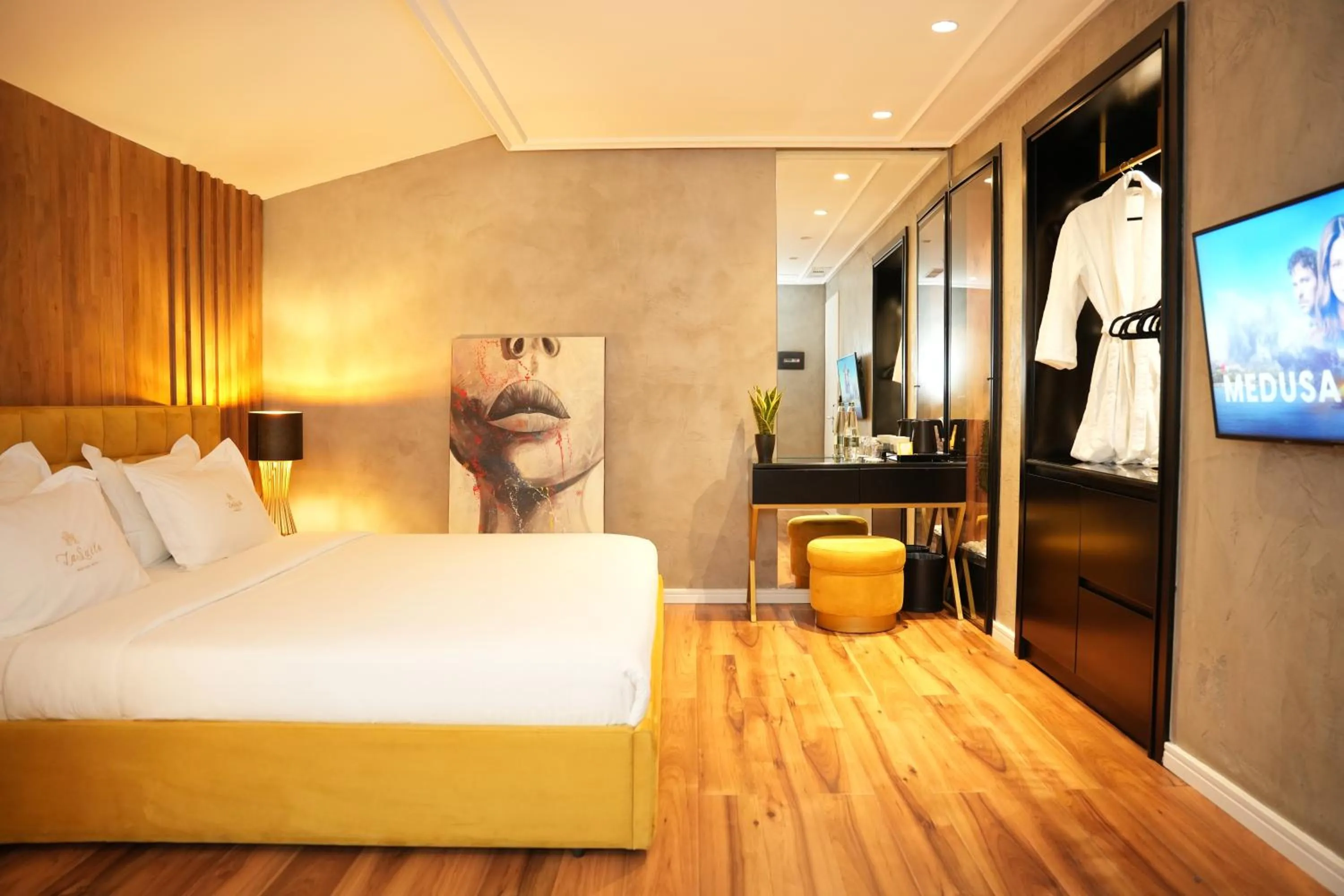 Bed in La Suite Boutique Hotel