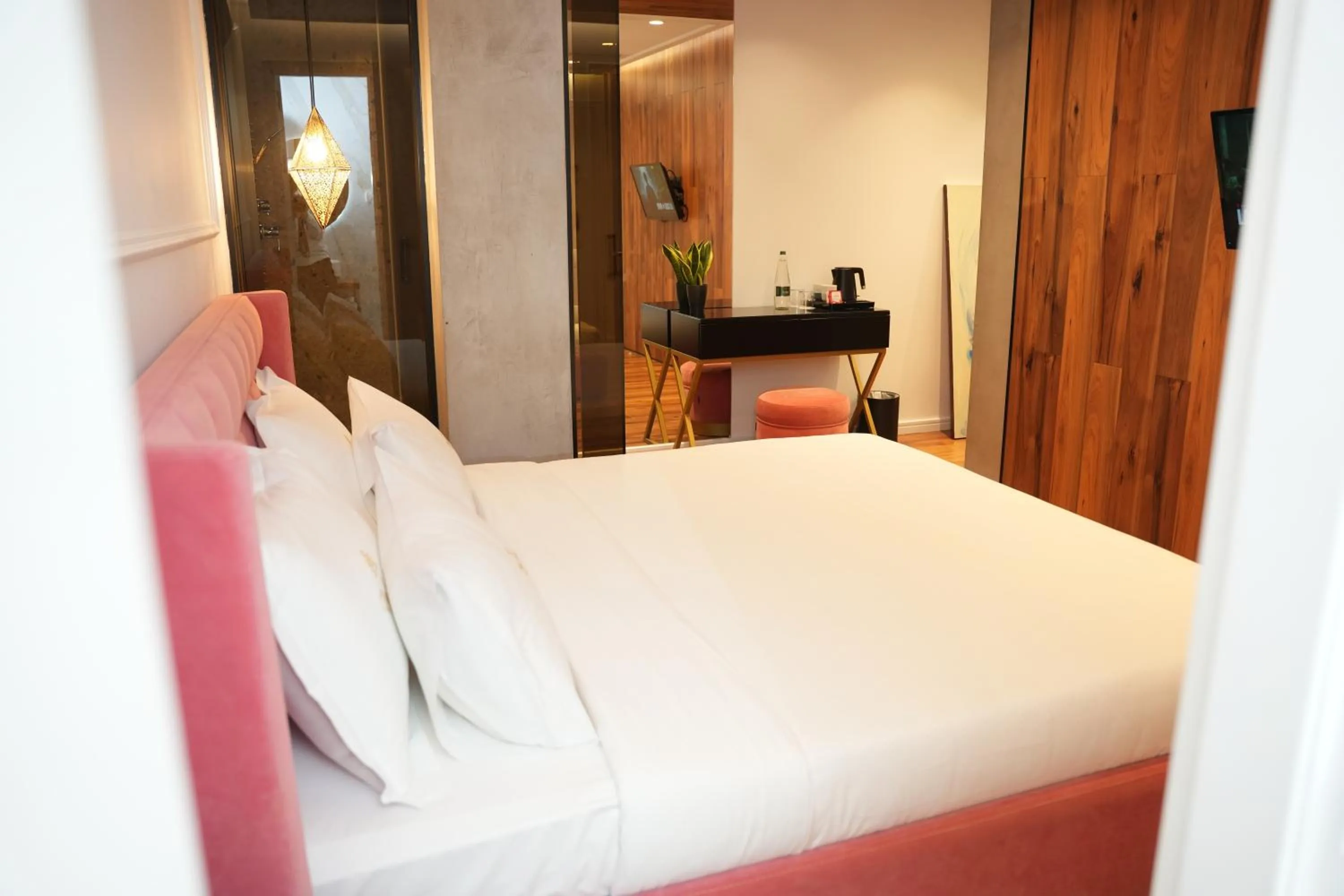 Bed in La Suite Boutique Hotel