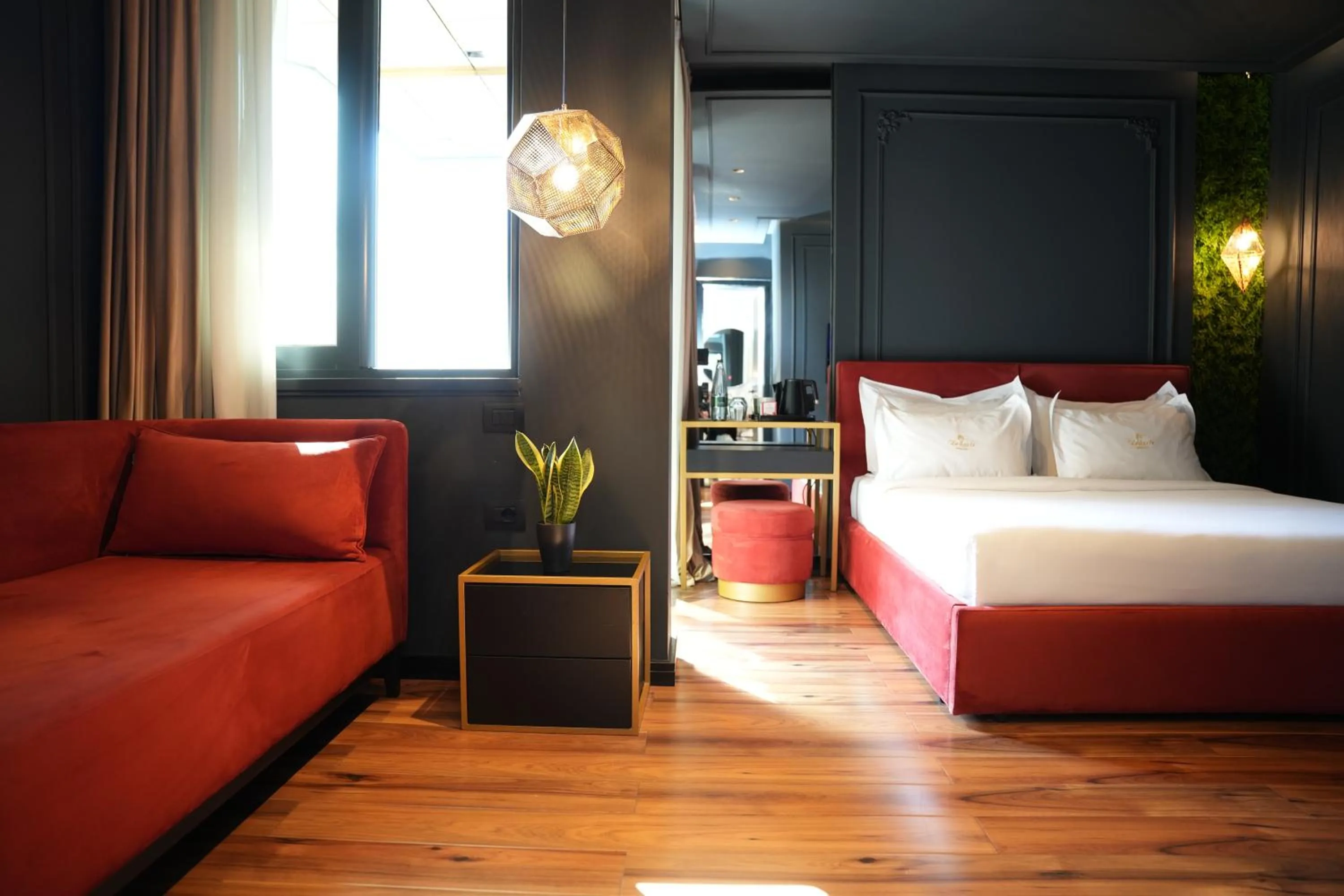 Bed in La Suite Boutique Hotel