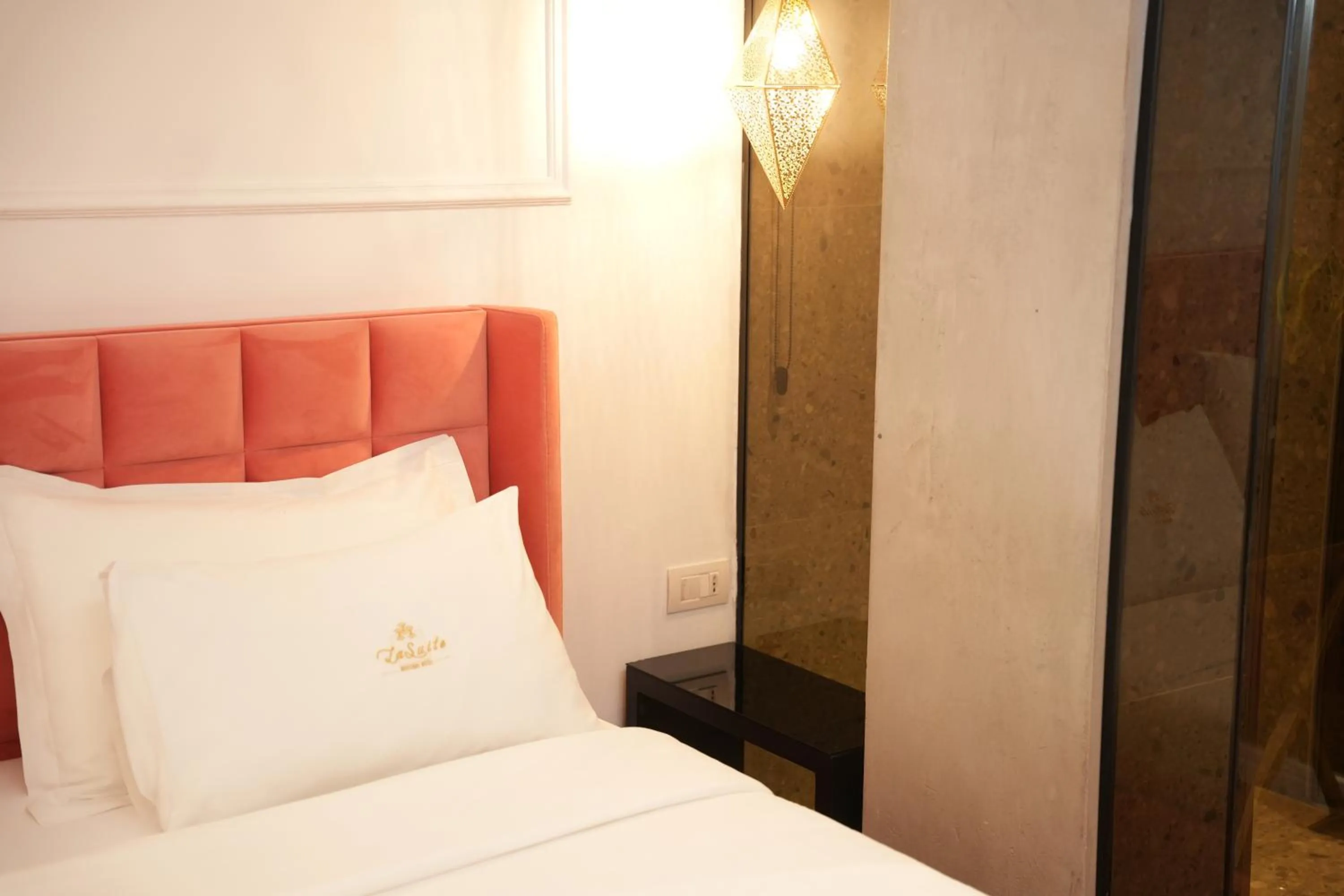 Bed in La Suite Boutique Hotel