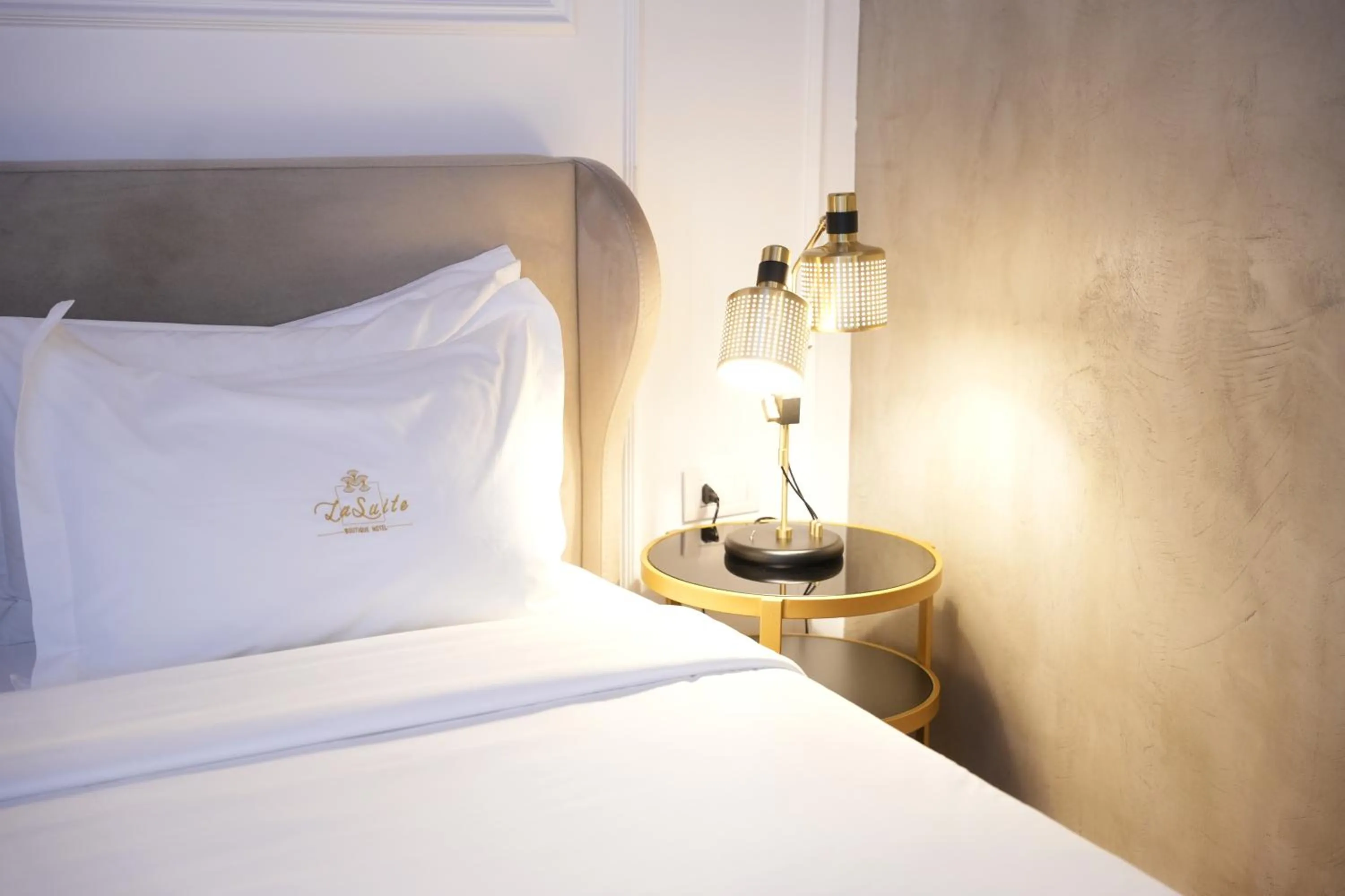 Bed in La Suite Boutique Hotel