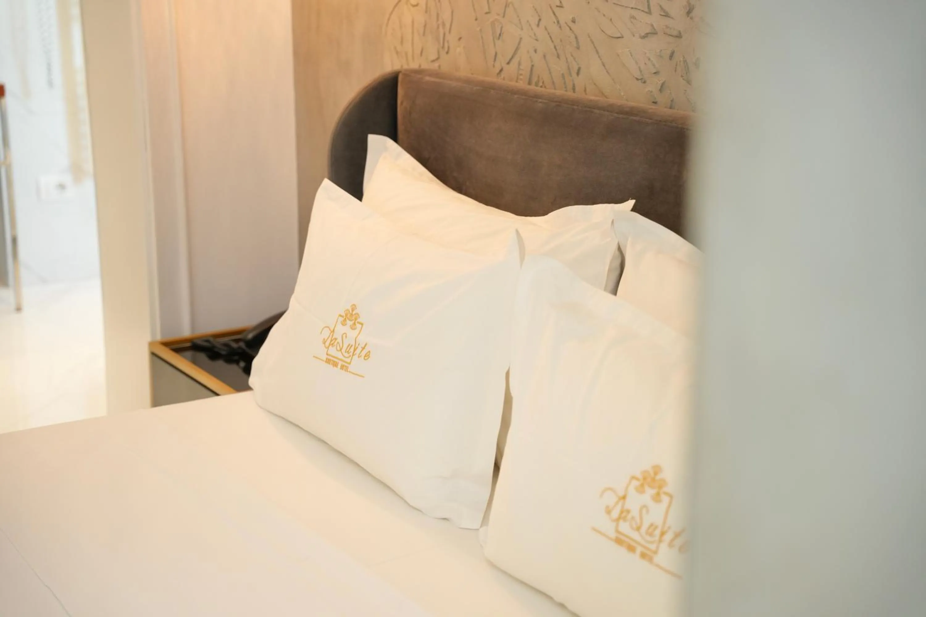 Bed in La Suite Boutique Hotel