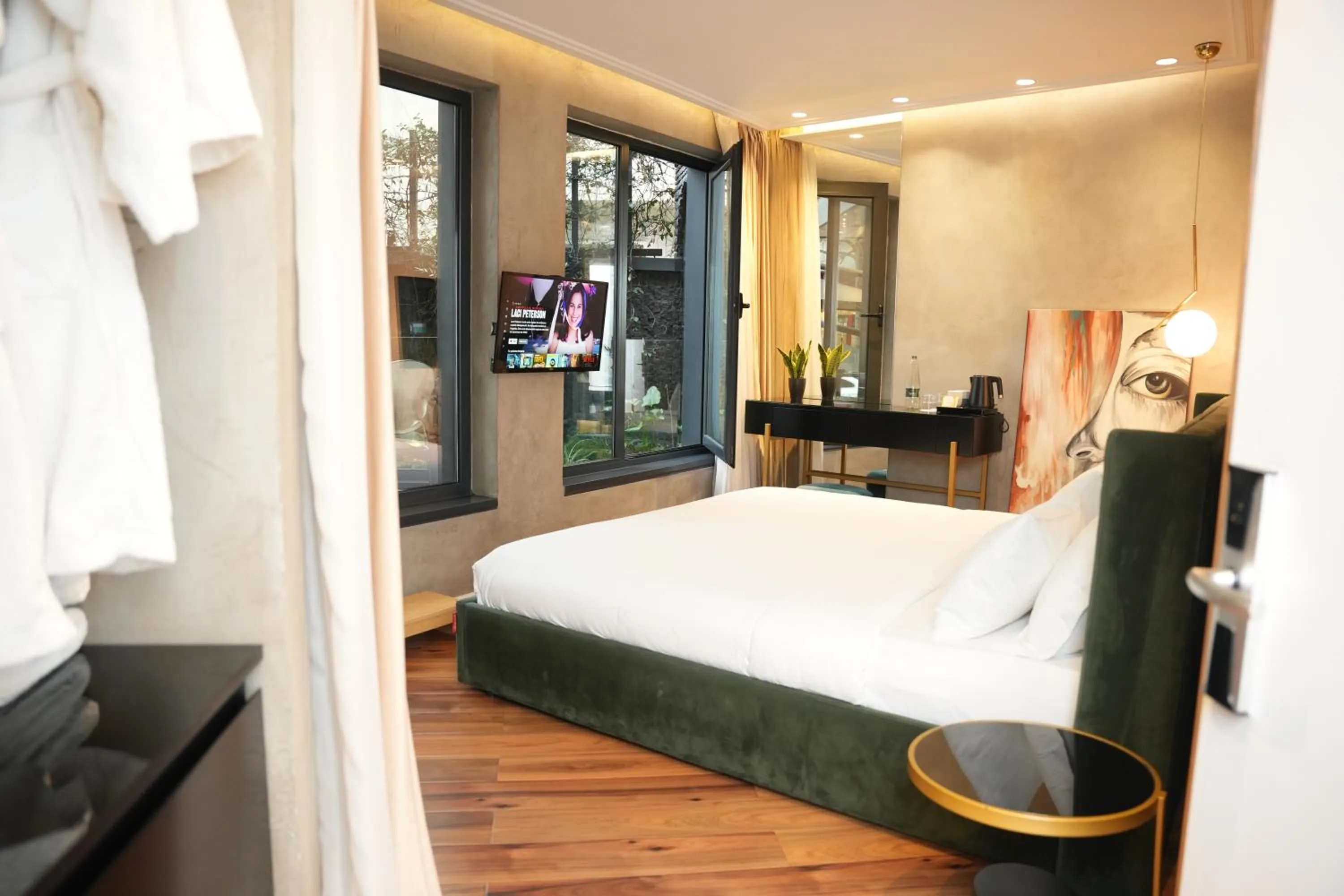 Bed in La Suite Boutique Hotel