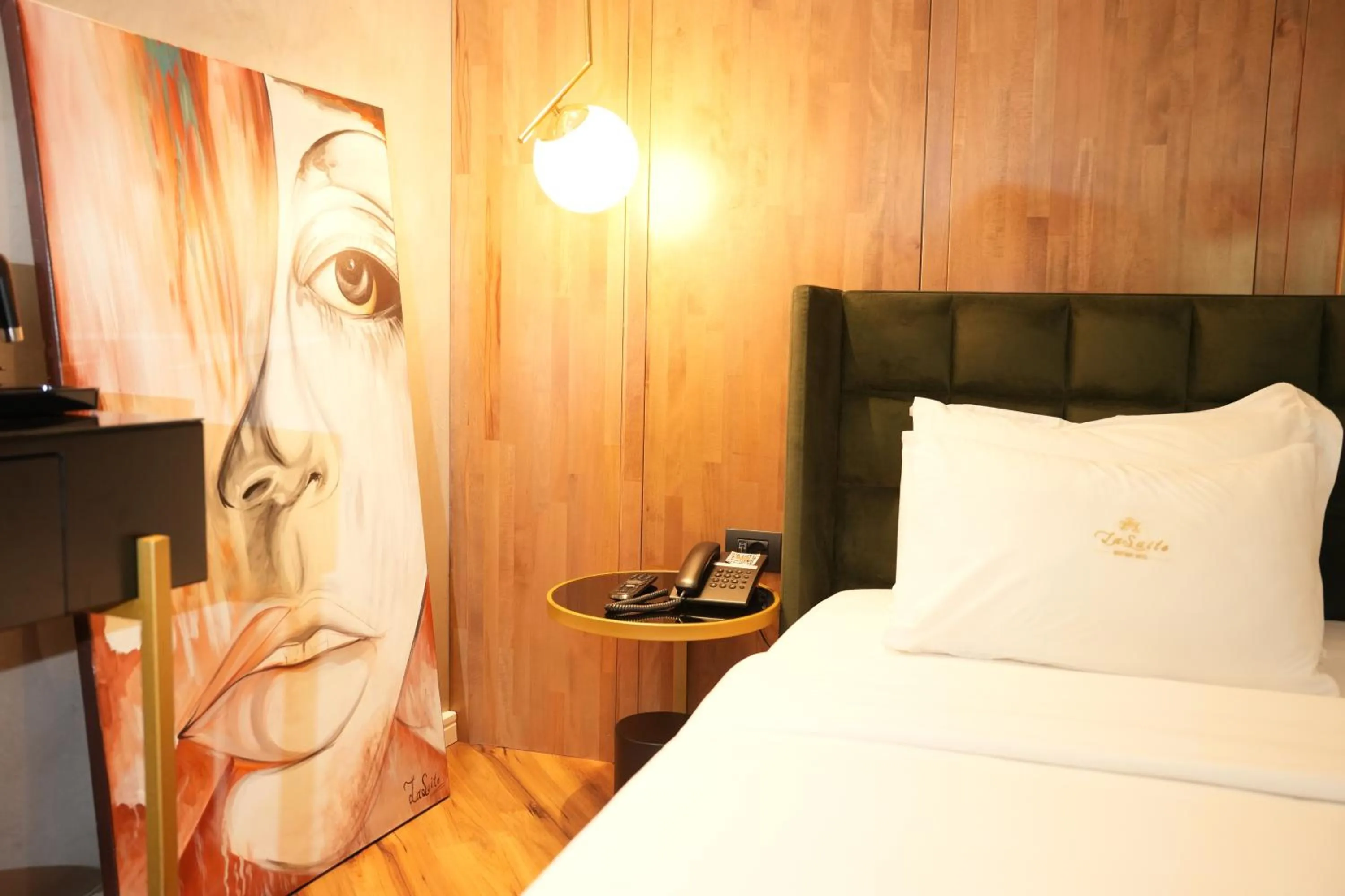 Bed in La Suite Boutique Hotel