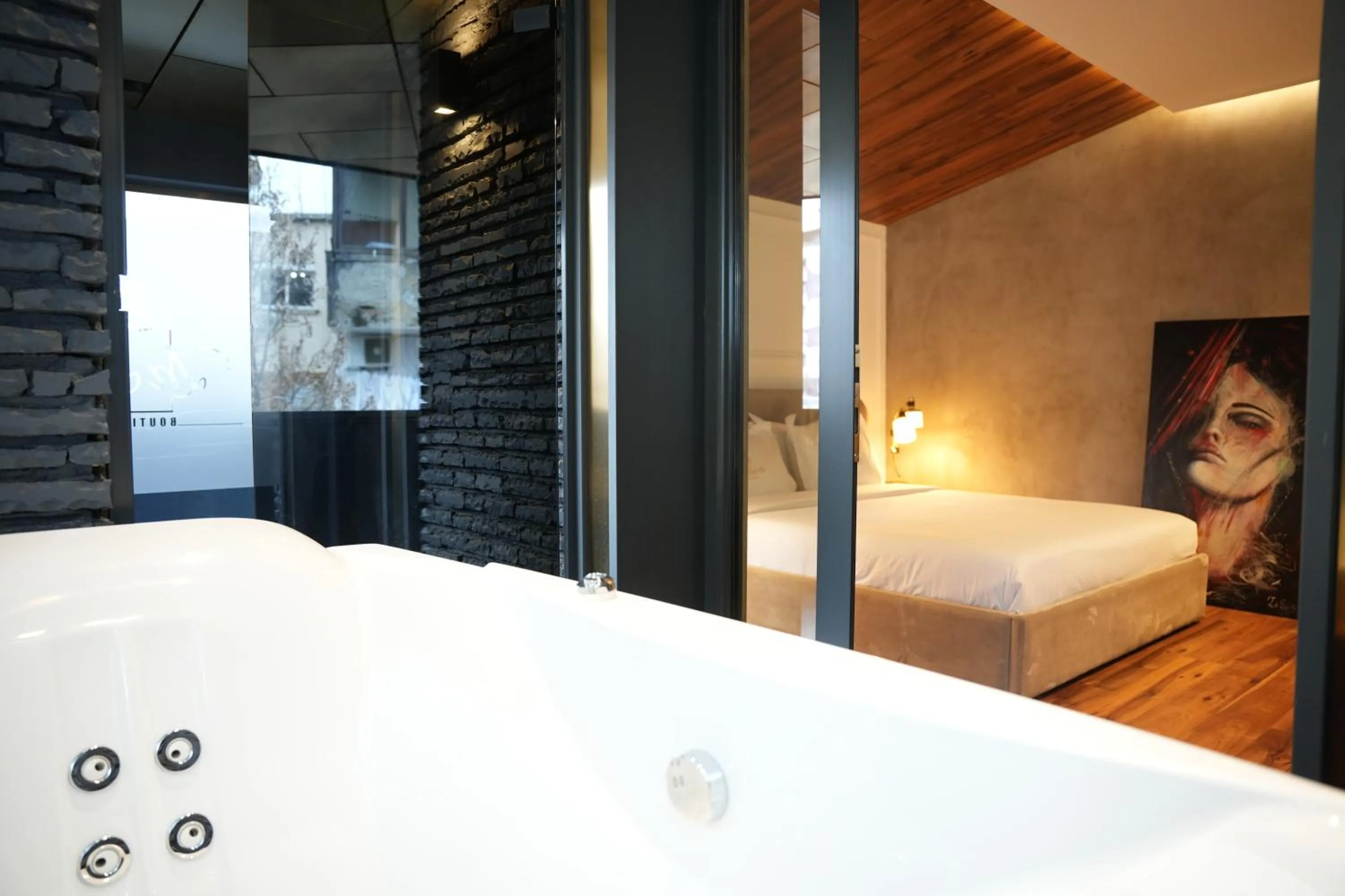 Bed in La Suite Boutique Hotel