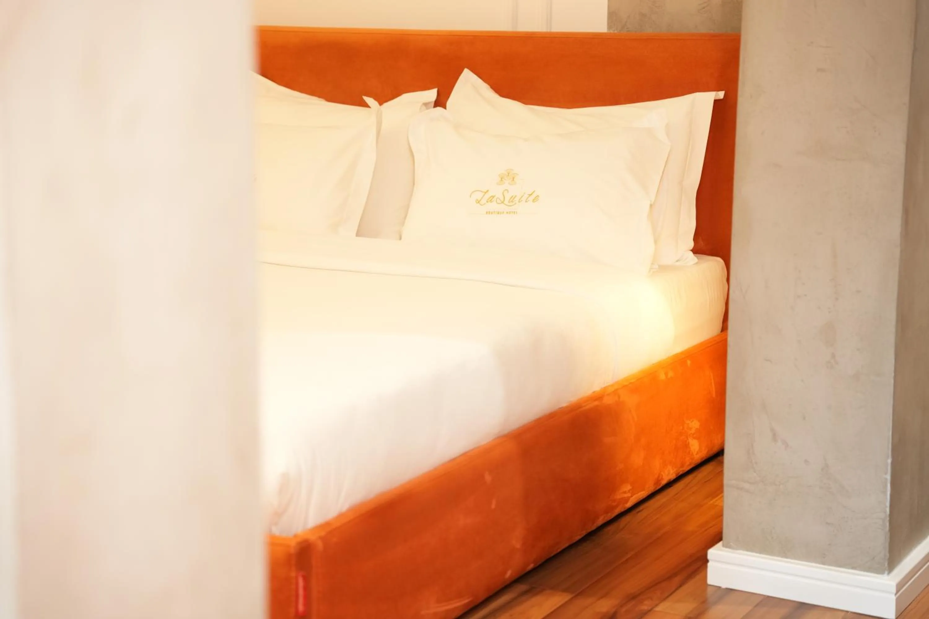 Bed in La Suite Boutique Hotel