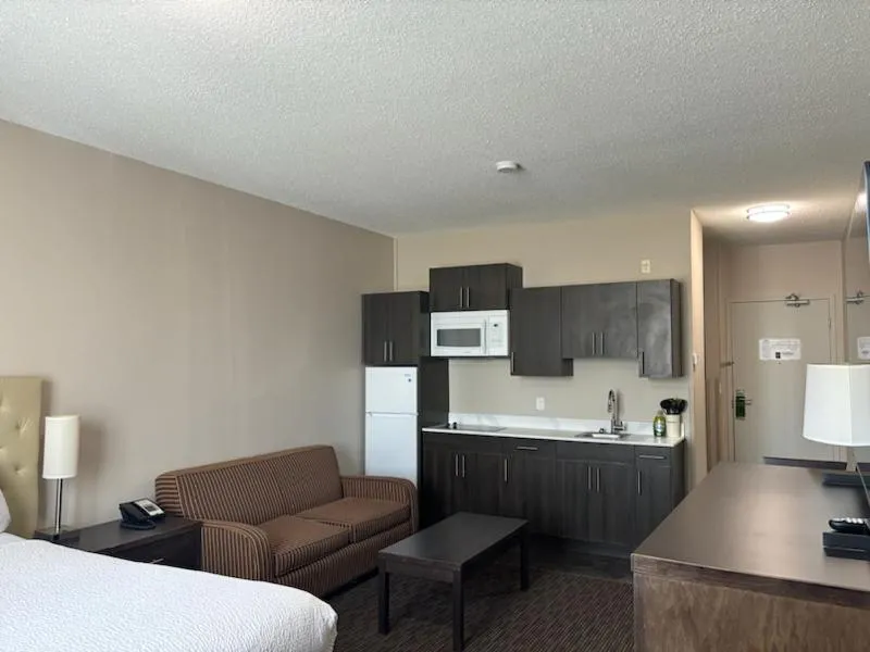 kitchen, Bed in Ramada by Wyndham Estevan