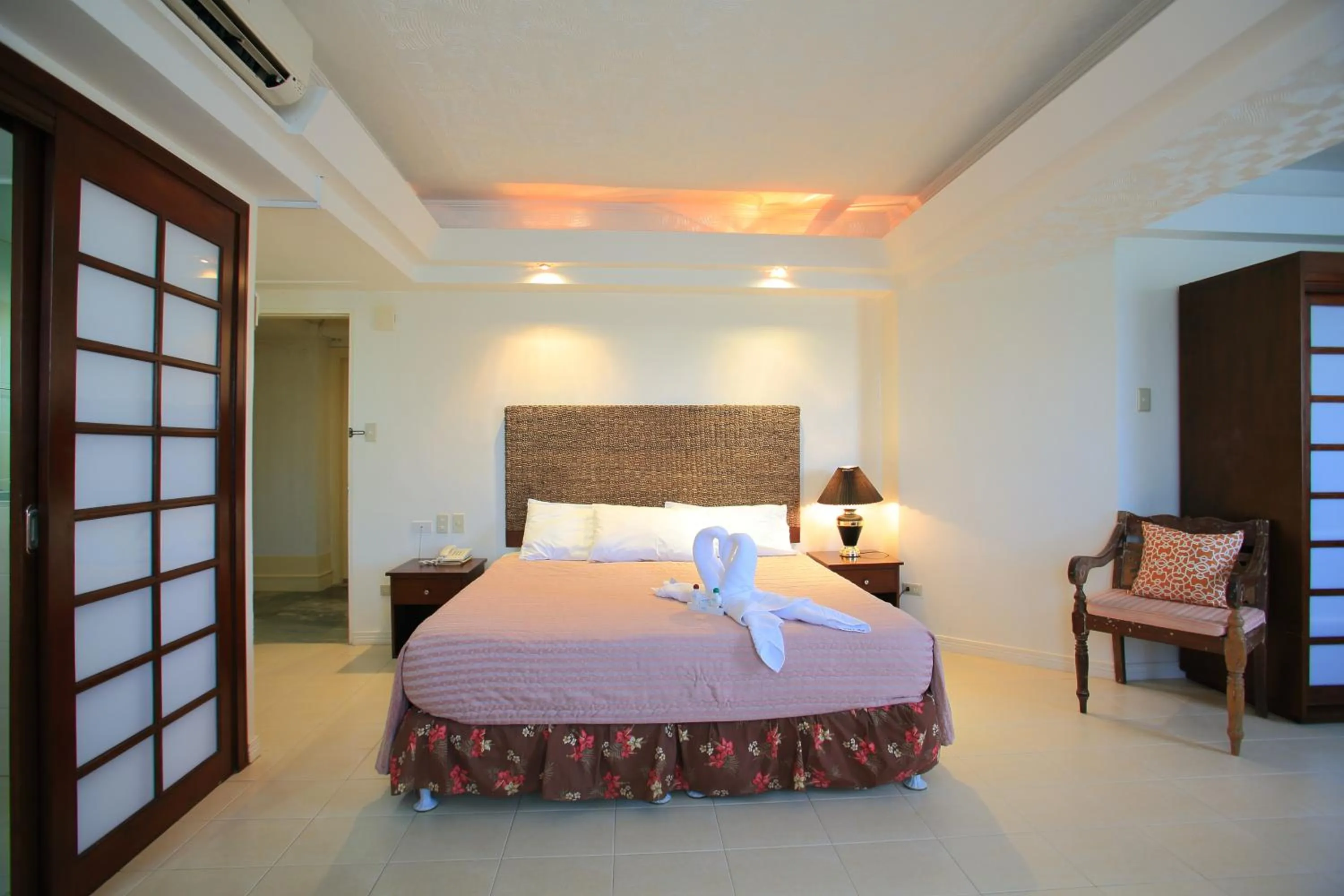 Bed in Wild Orchid Beach Resort