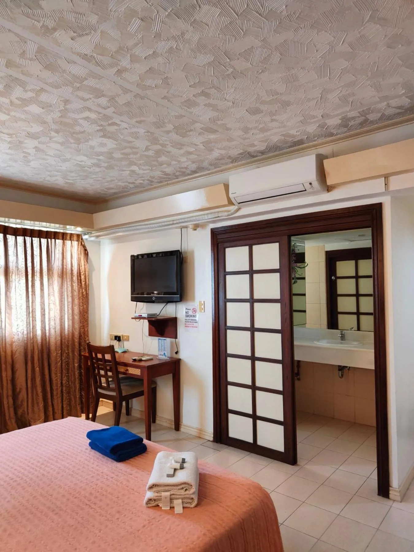 air conditioner, Bed in Wild Orchid Beach Resort