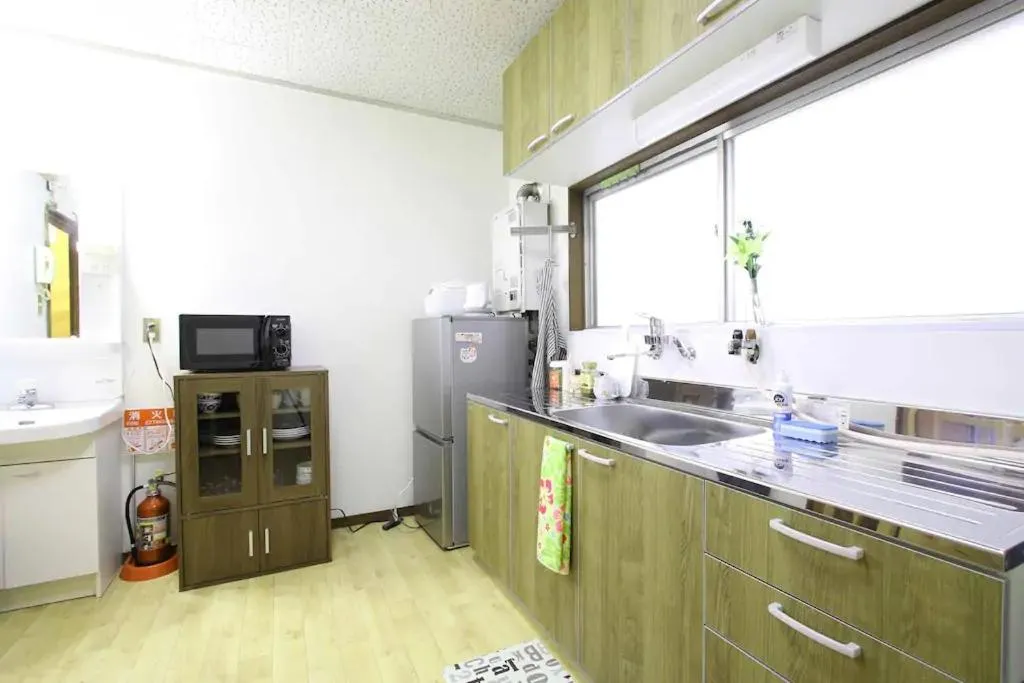 Kitchen or kitchenette in Masaru House