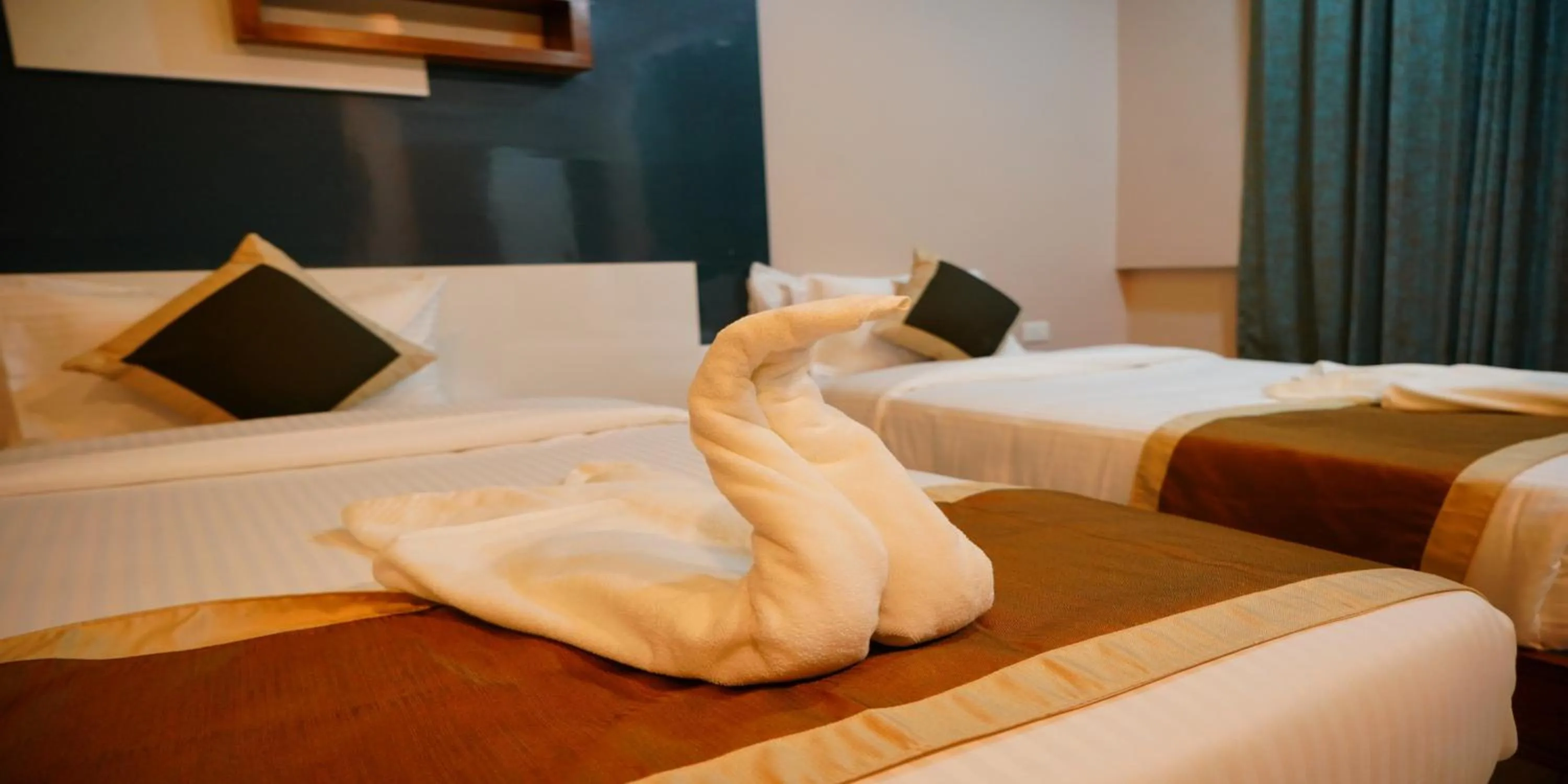 Bed in Nextel Inn, Calicut