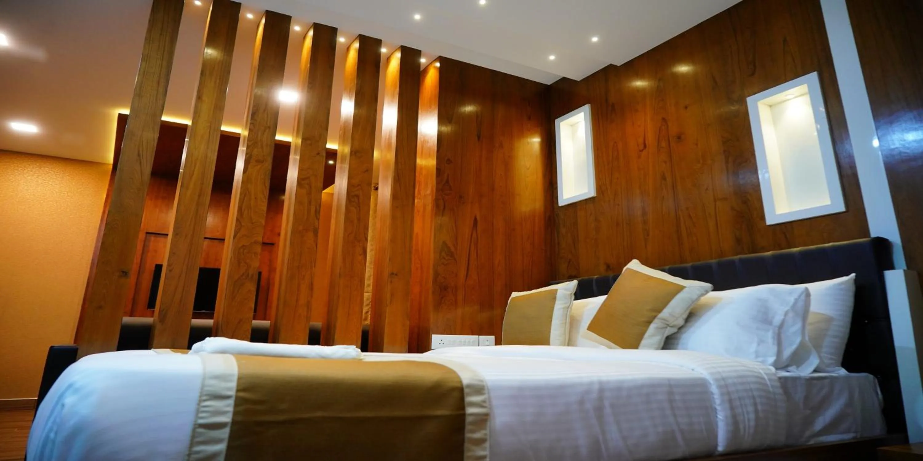 Bed in Nextel Inn, Calicut