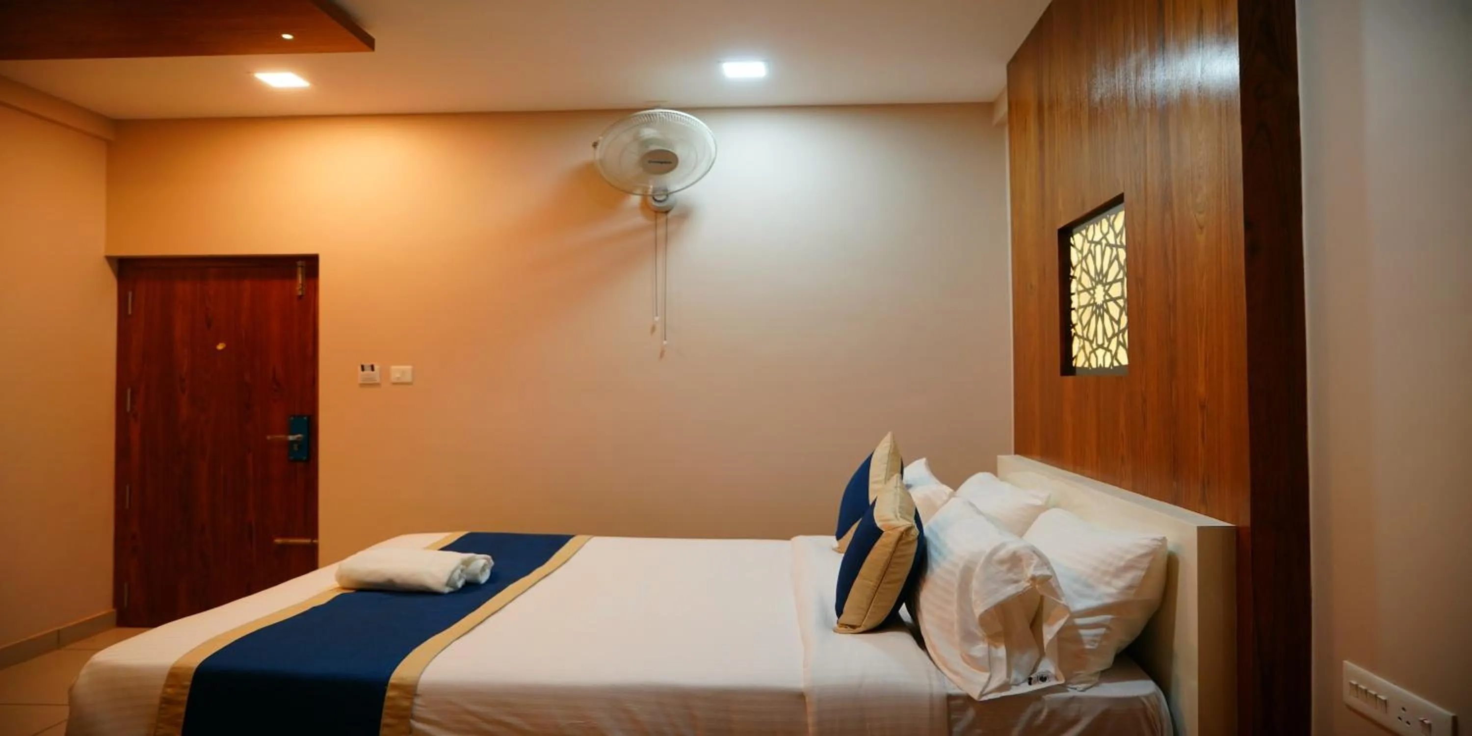 Bed in Nextel Inn, Calicut