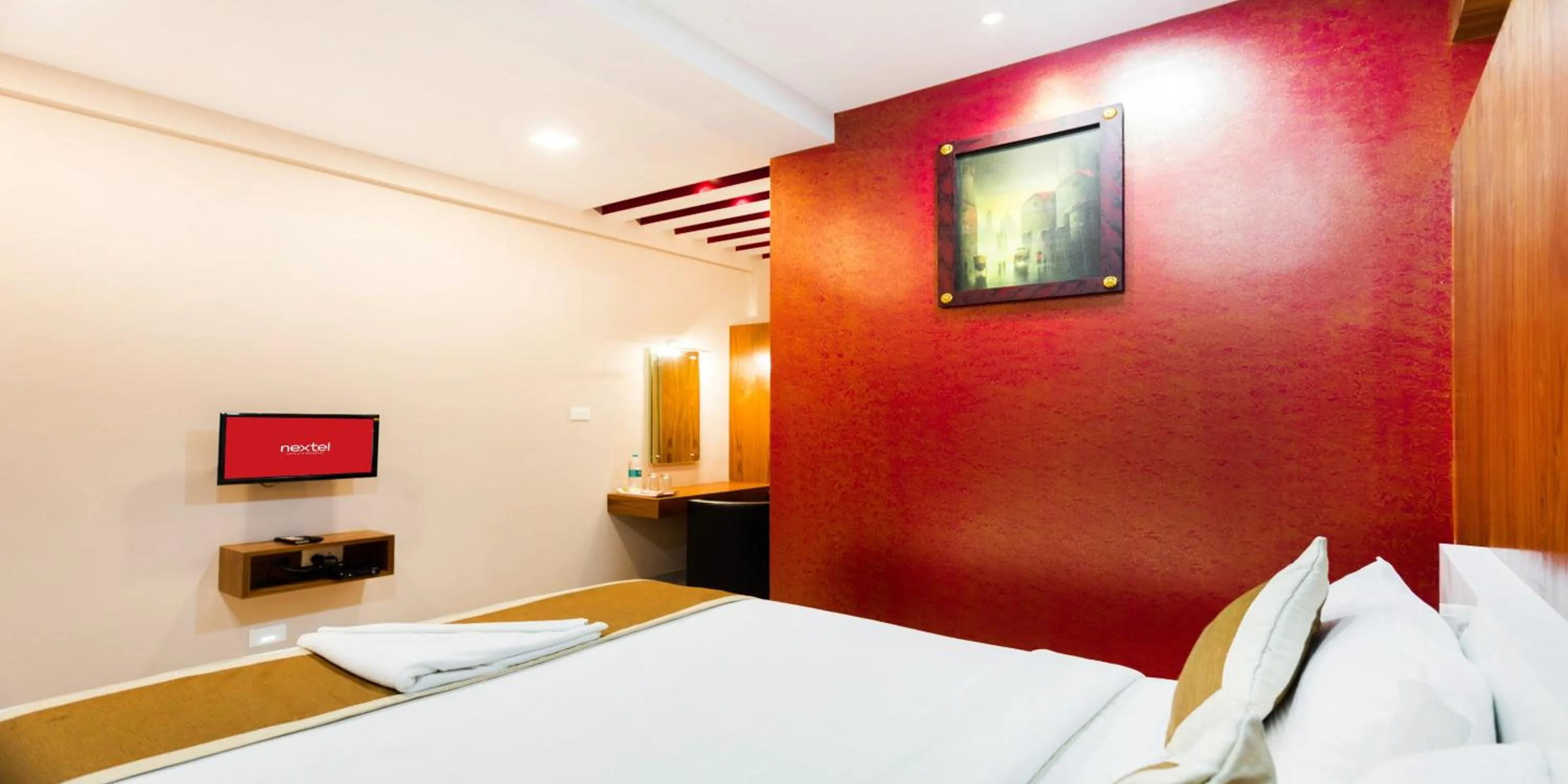 Photo of the whole room, Bed in Nextel Inn, Calicut