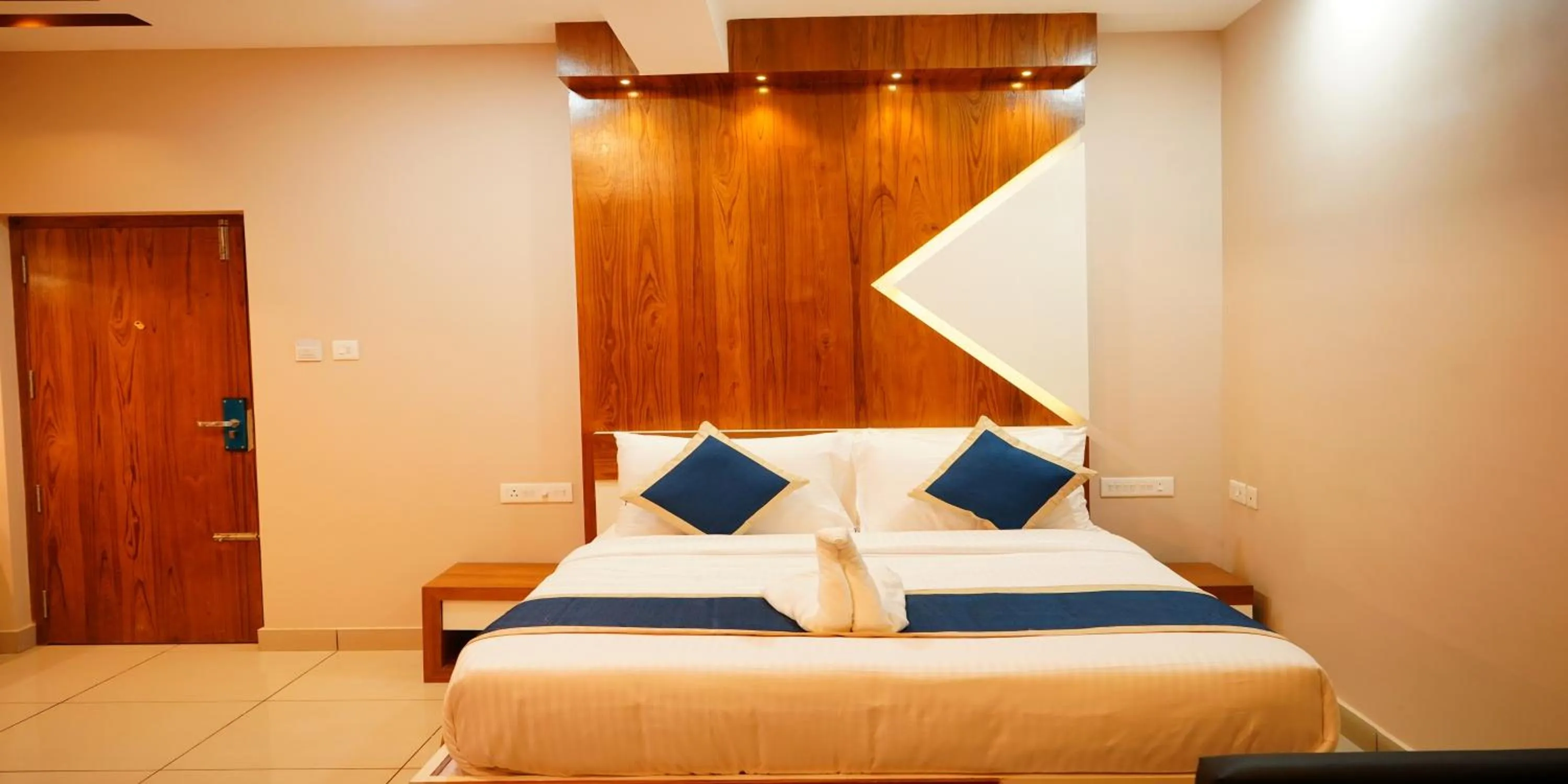 Bed in Nextel Inn, Calicut