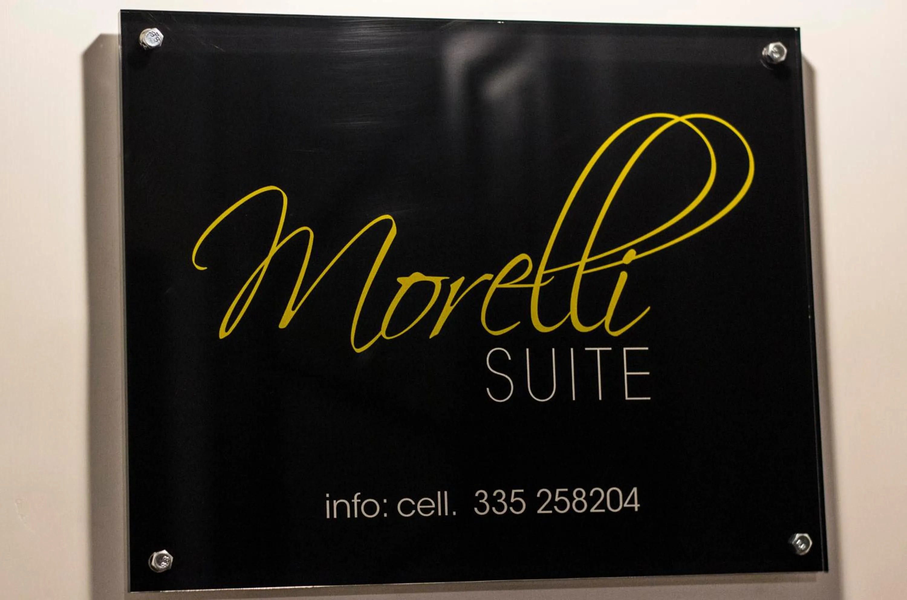 Property logo or sign in Morelli suite