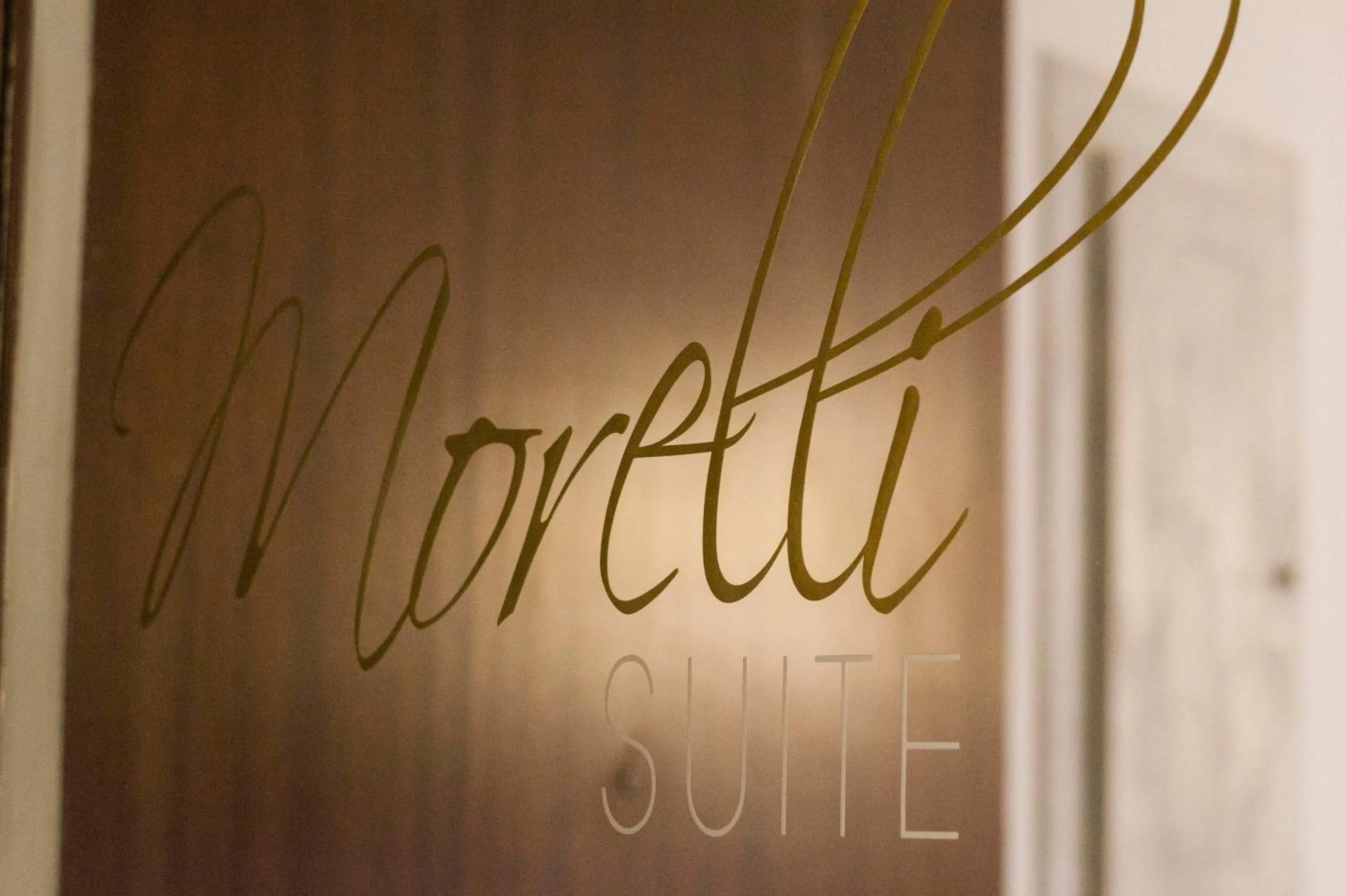 Property logo or sign in Morelli suite