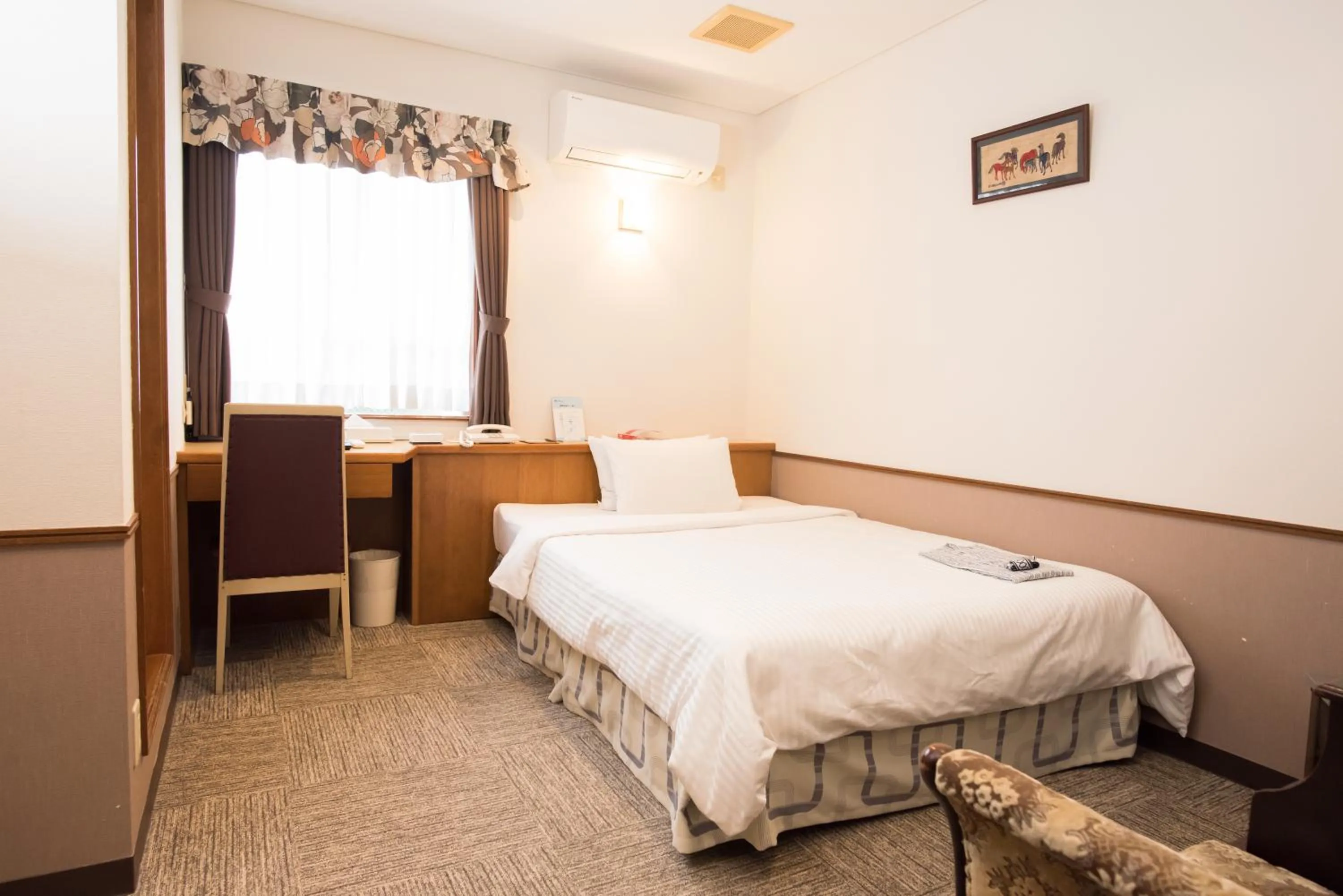 Bed in Crown Hotel Okinawa