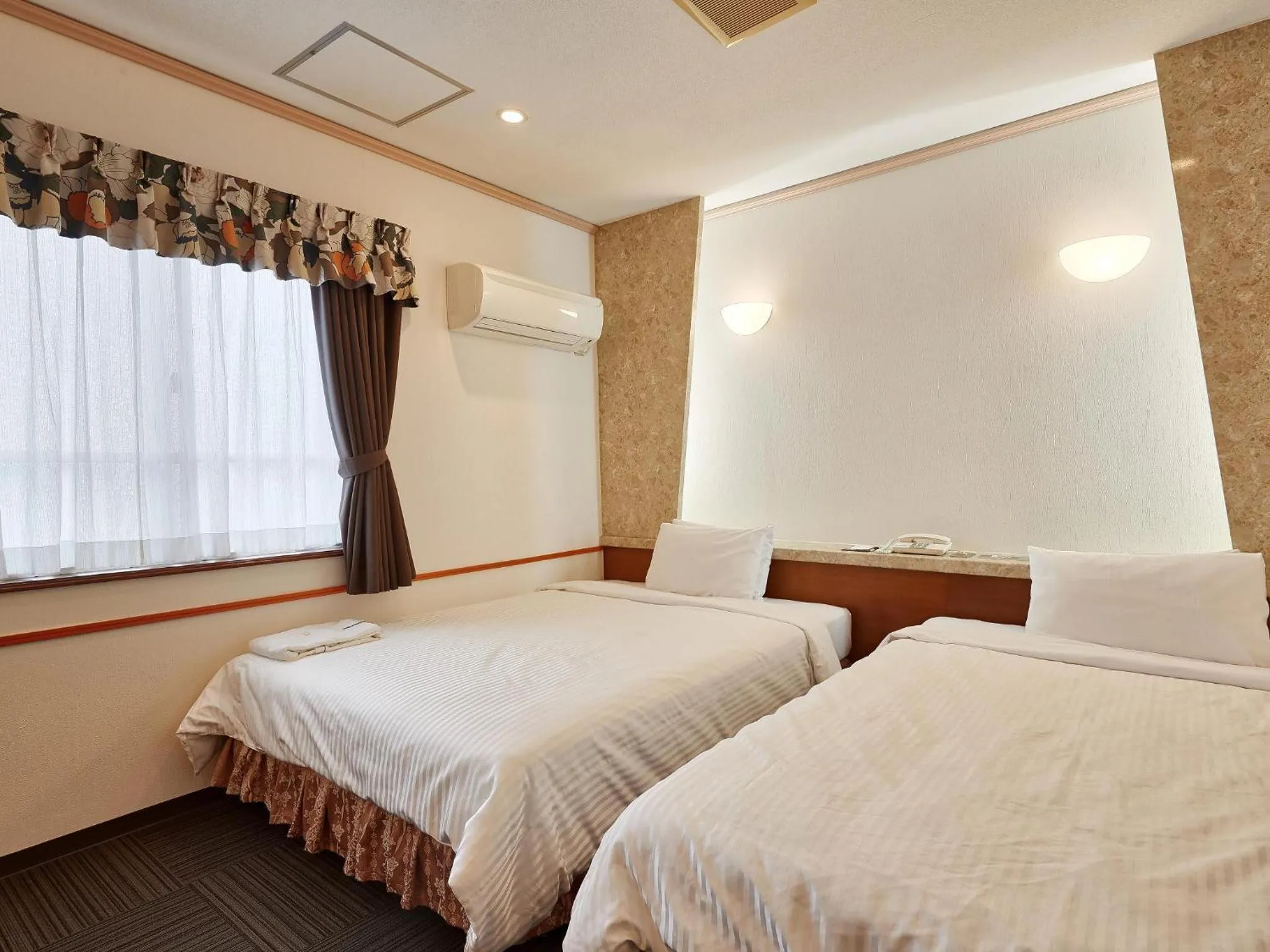 Photo of the whole room, Bed in Crown Hotel Okinawa
