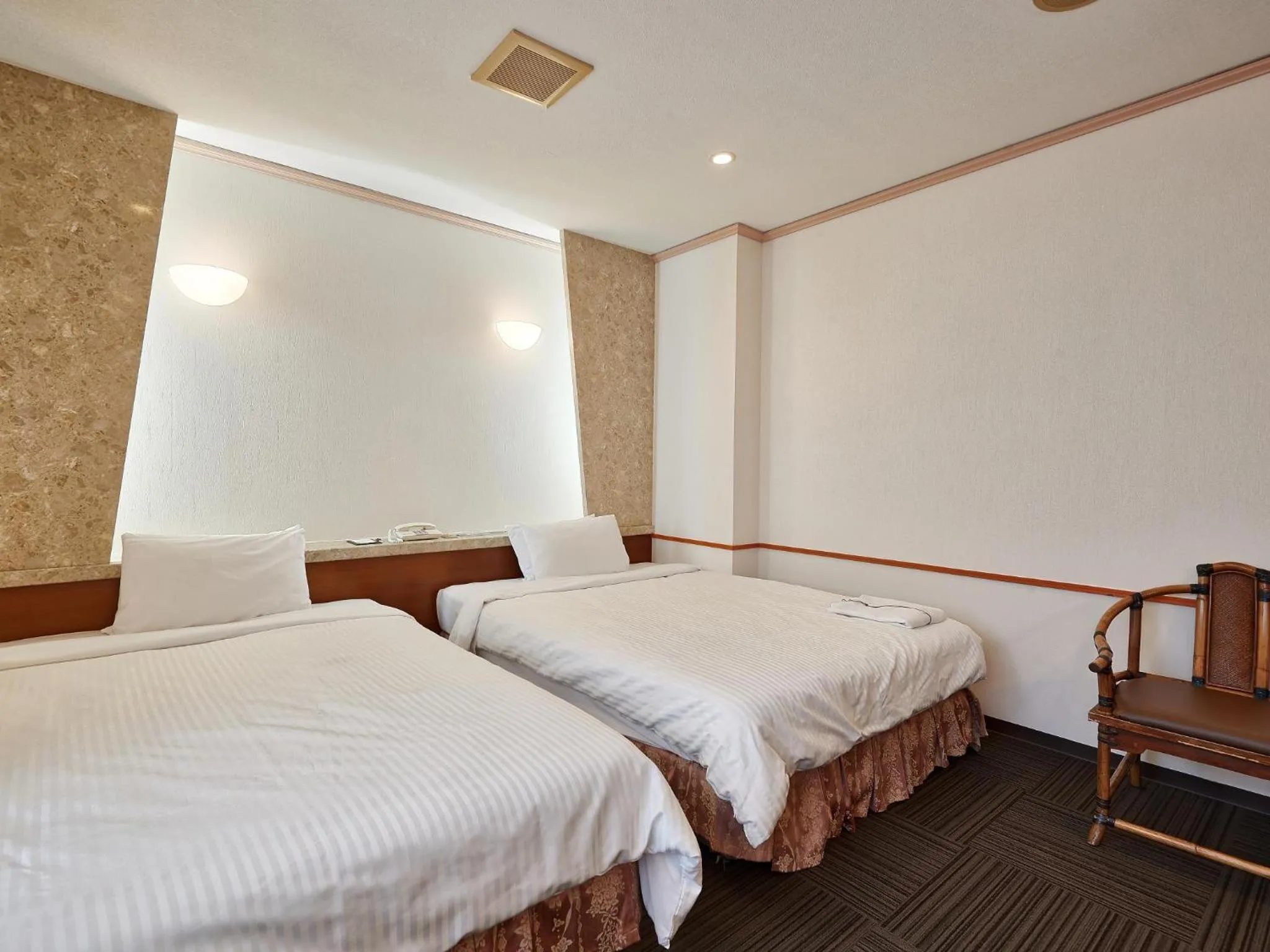 Photo of the whole room, Bed in Crown Hotel Okinawa